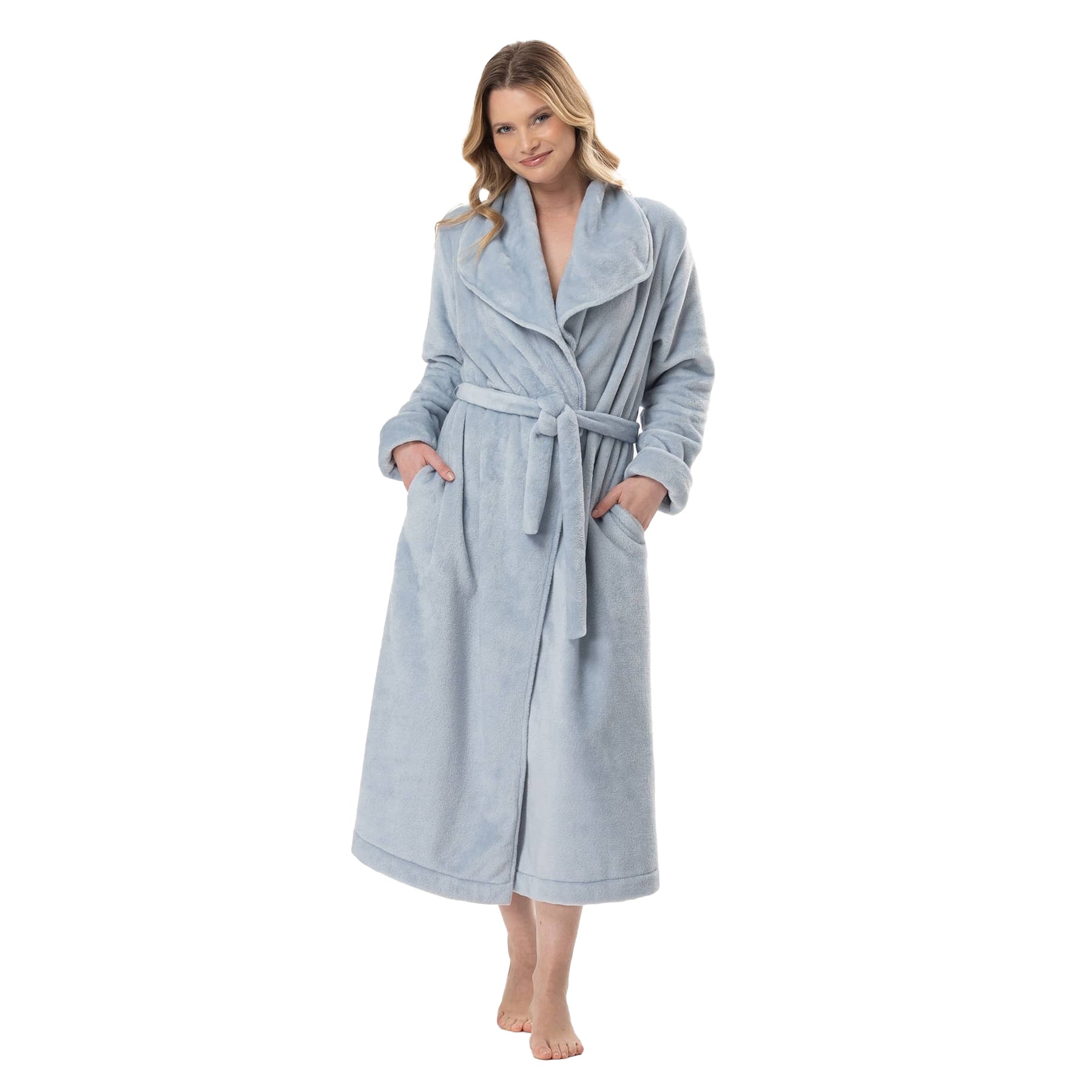 Woman smiling in sky-blue robe tied at the waist with side pockets.
