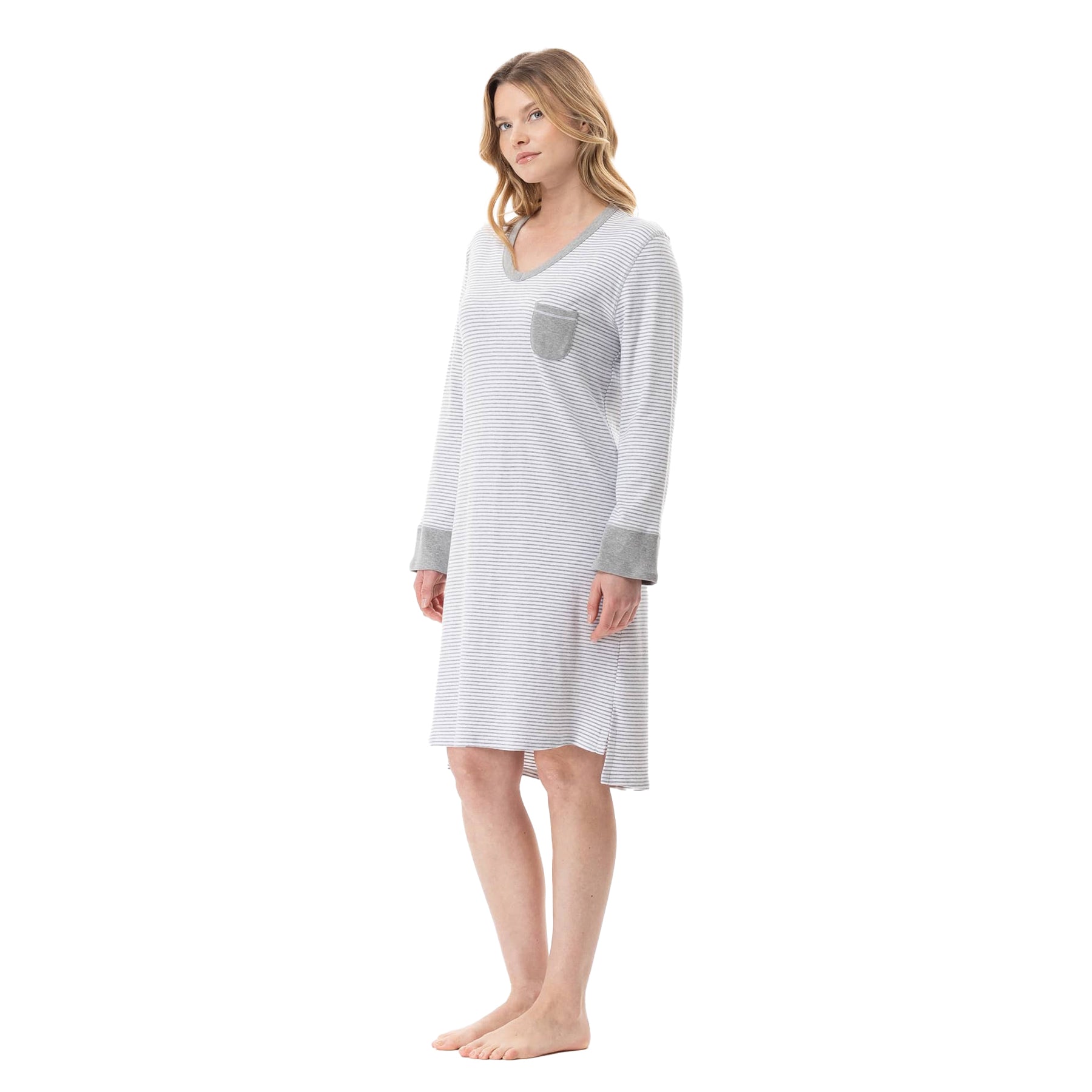 Woman wearing a long-sleeve nightshirt on a white background