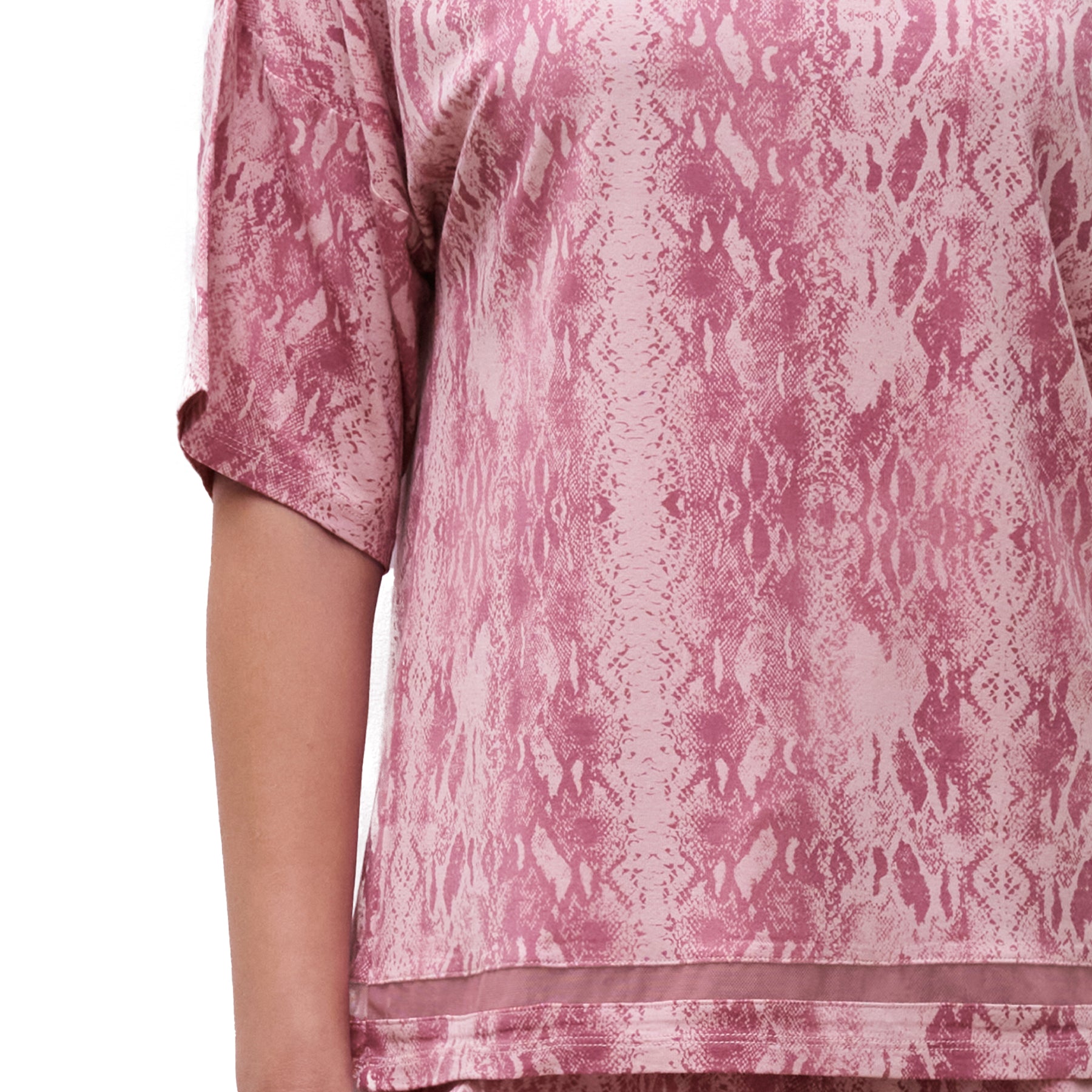 Detail view of pink snake-print sleep top highlighting sleeve length and relaxed drape.
