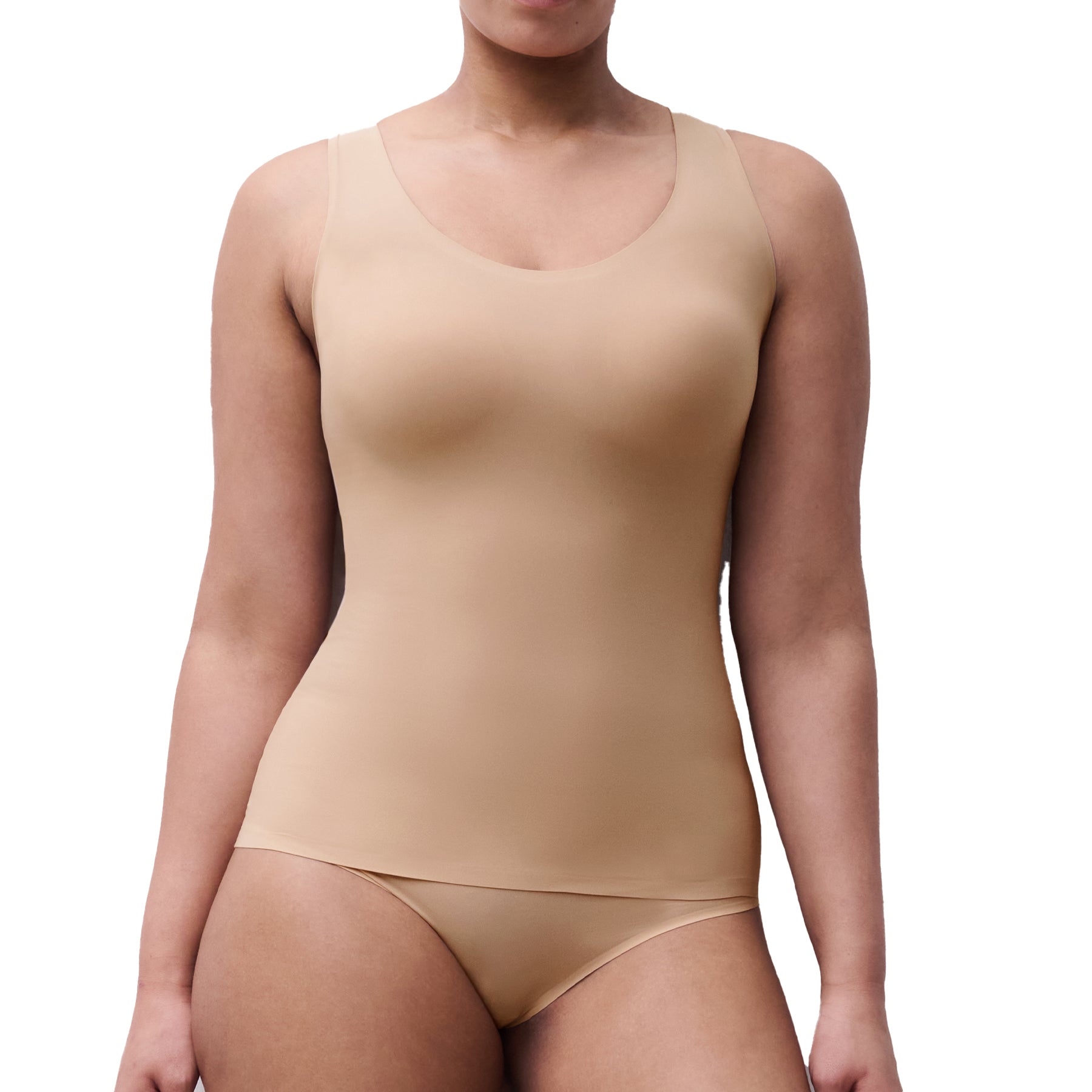 Model wearing nude padded tank top with seamless design and built-in support.