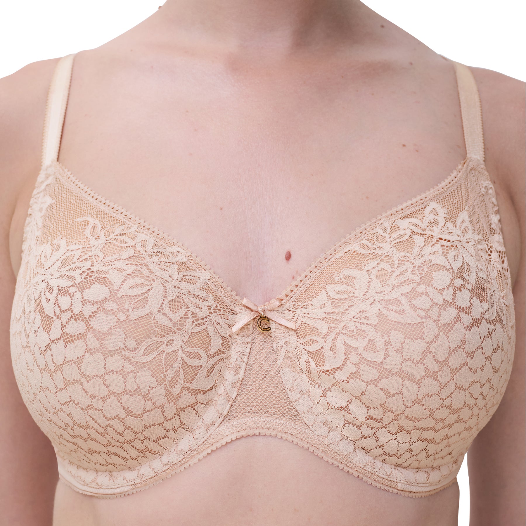 Close-up of Chantelle lace bra in peau rosée, showing floral lace details and supportive cups.