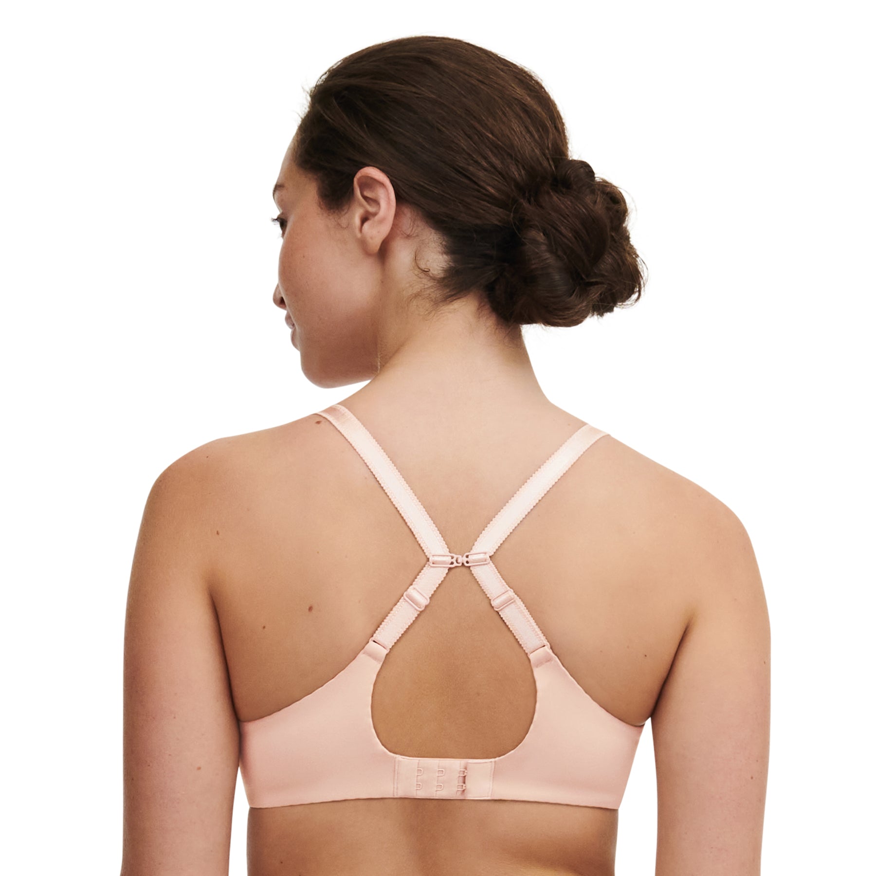 Back view of model wearing nude rose plunge bra with racerback strap option.