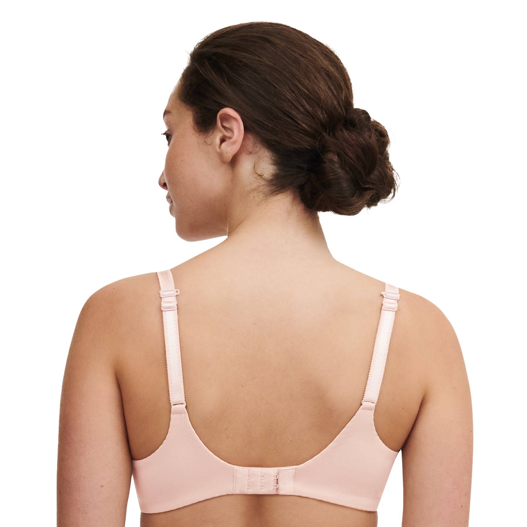 Back view of model wearing nude rose plunge bra with traditional strap style.