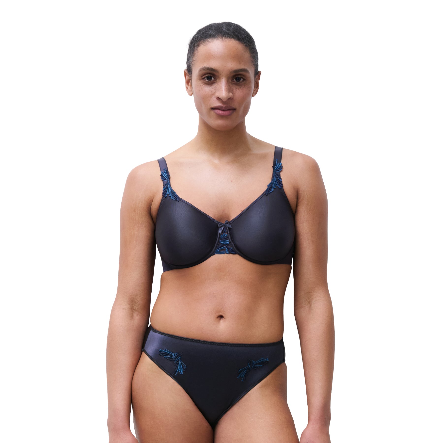 Model wearing Chantelle Hedona seamless bra in deep navy paired with matching briefs for a sleek everyday look.