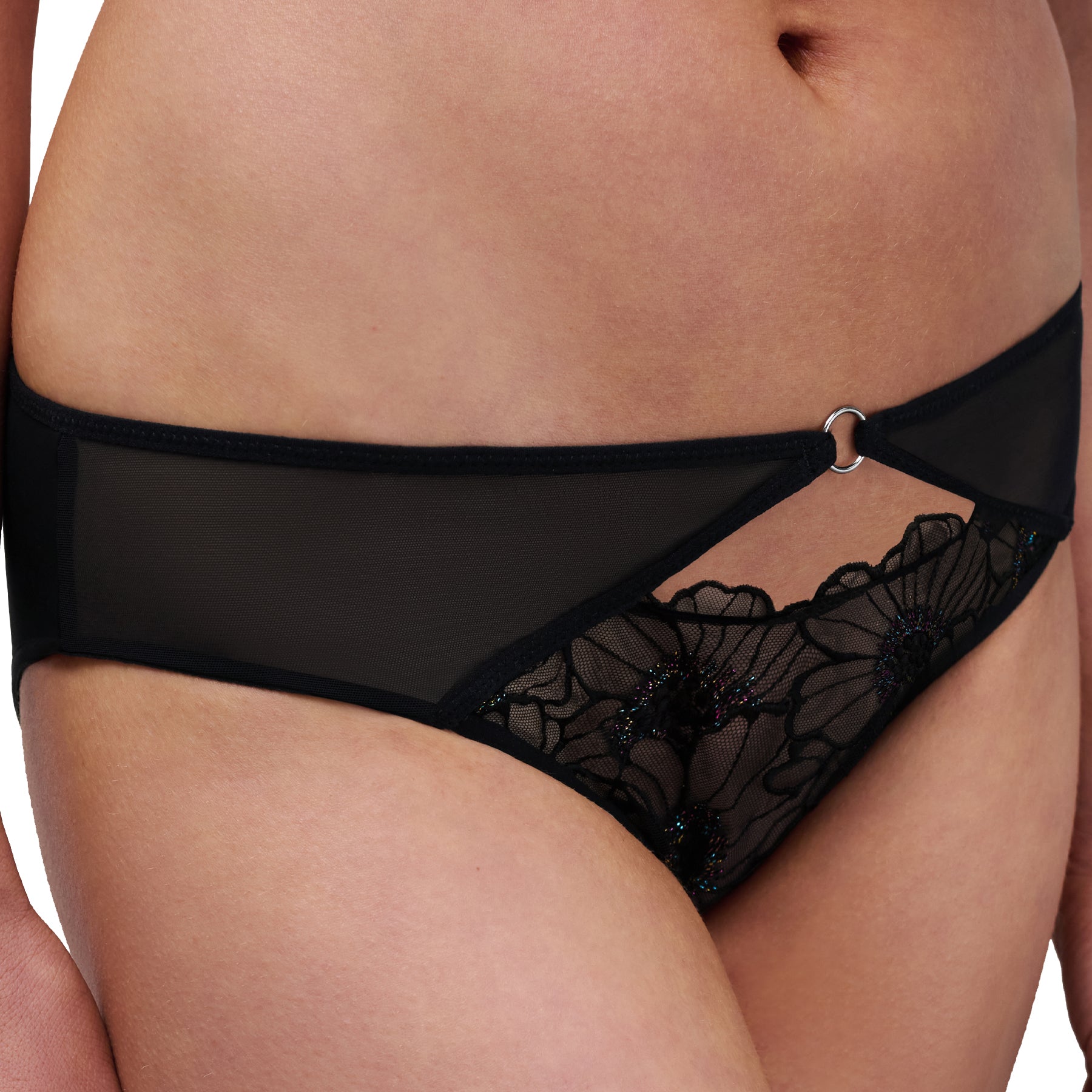 Close-up side view of black mesh and floral embroidered bikini brief with cut-out detail and silver ring accent.