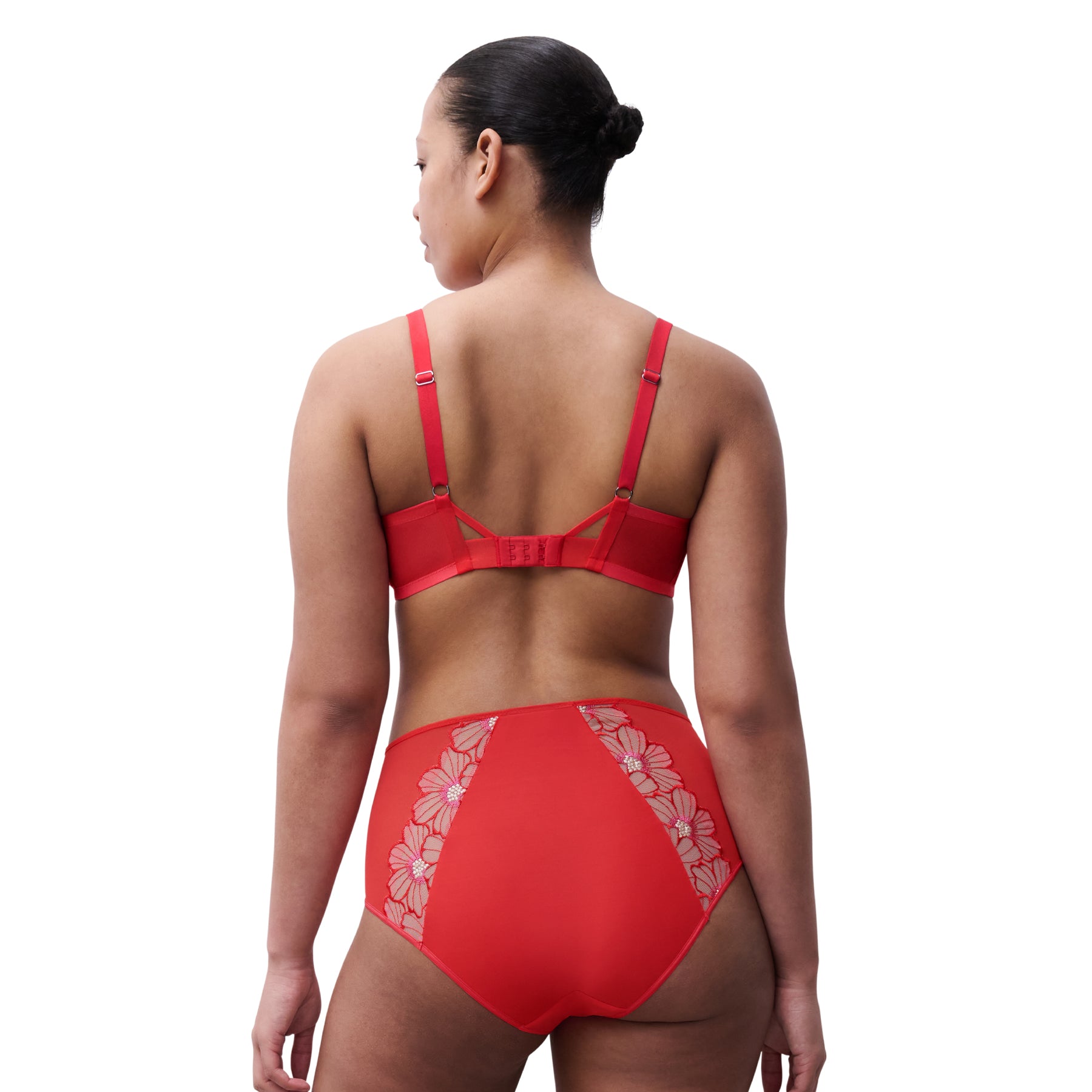 Red lingerie set with floral details on a white background