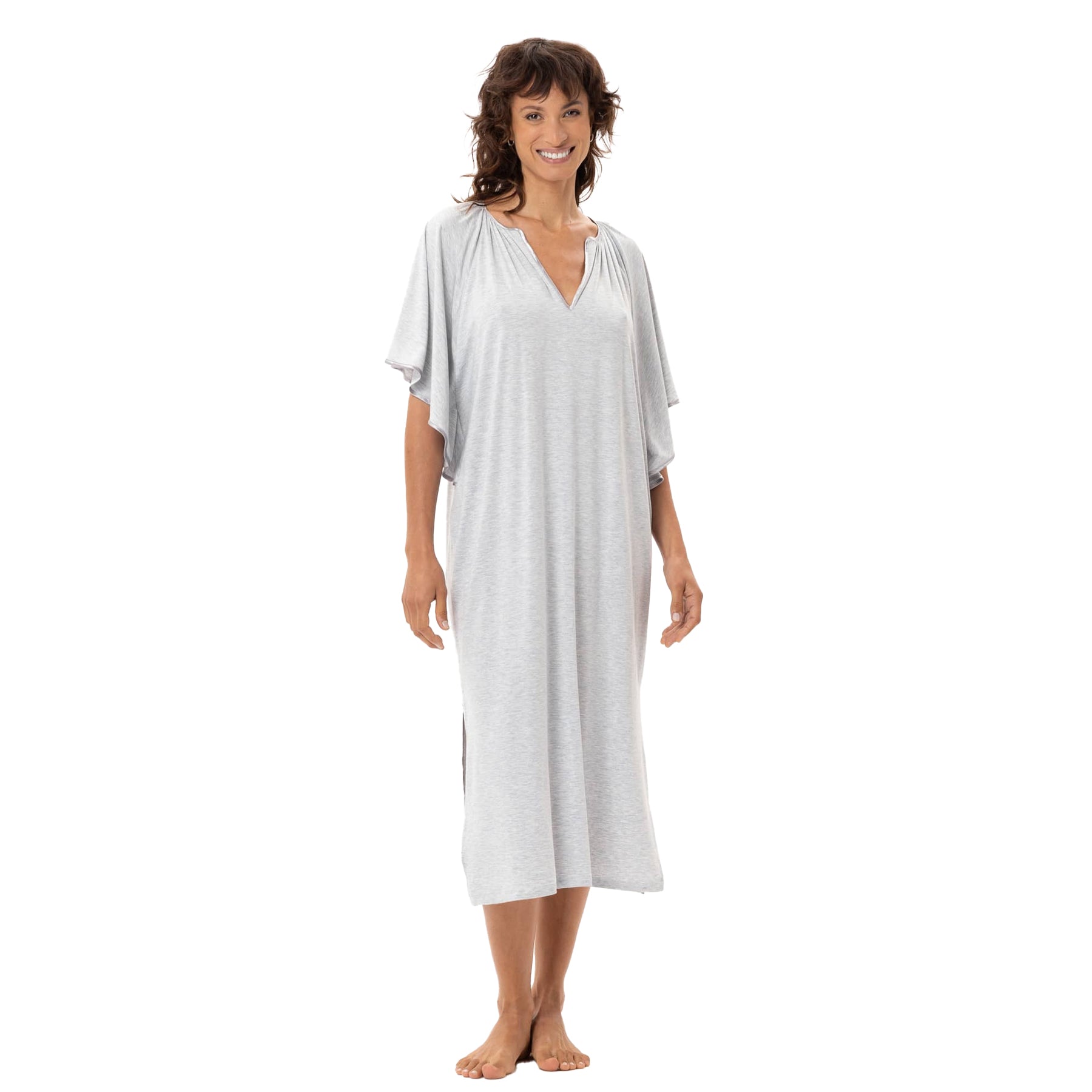 Woman wearing light grey heather nightgown with flowy flutter sleeves and mid-calf length, soft drape silhouette