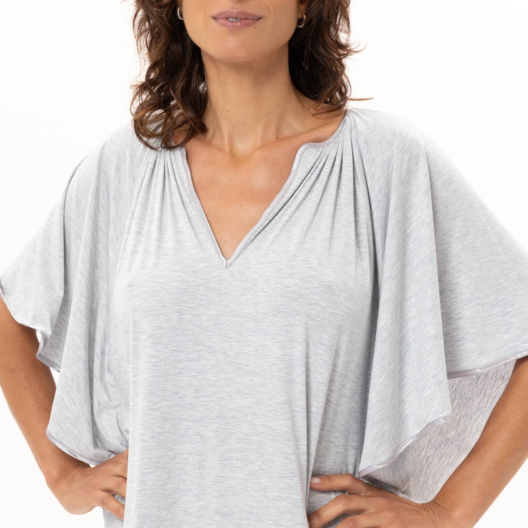 Close-up of light grey heather nightgown showing V-neckline with gathered pleats and soft breathable fabric