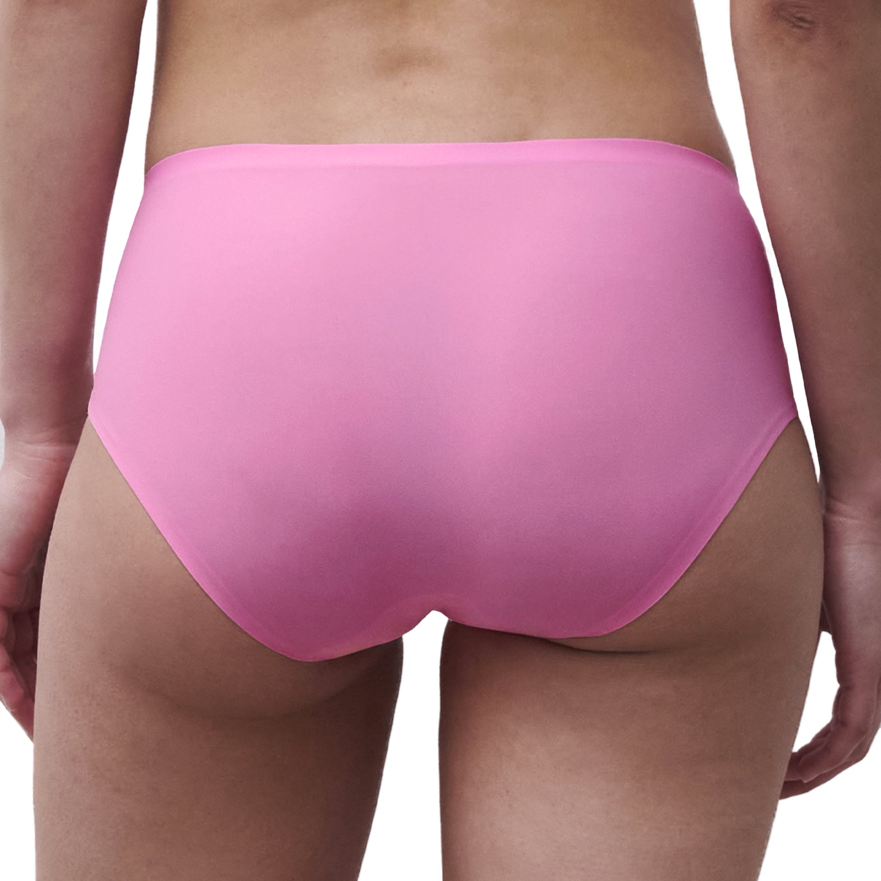 Close-up back view of a peony pink seamless bikini brief with a smooth second-skin finish and invisible edges.