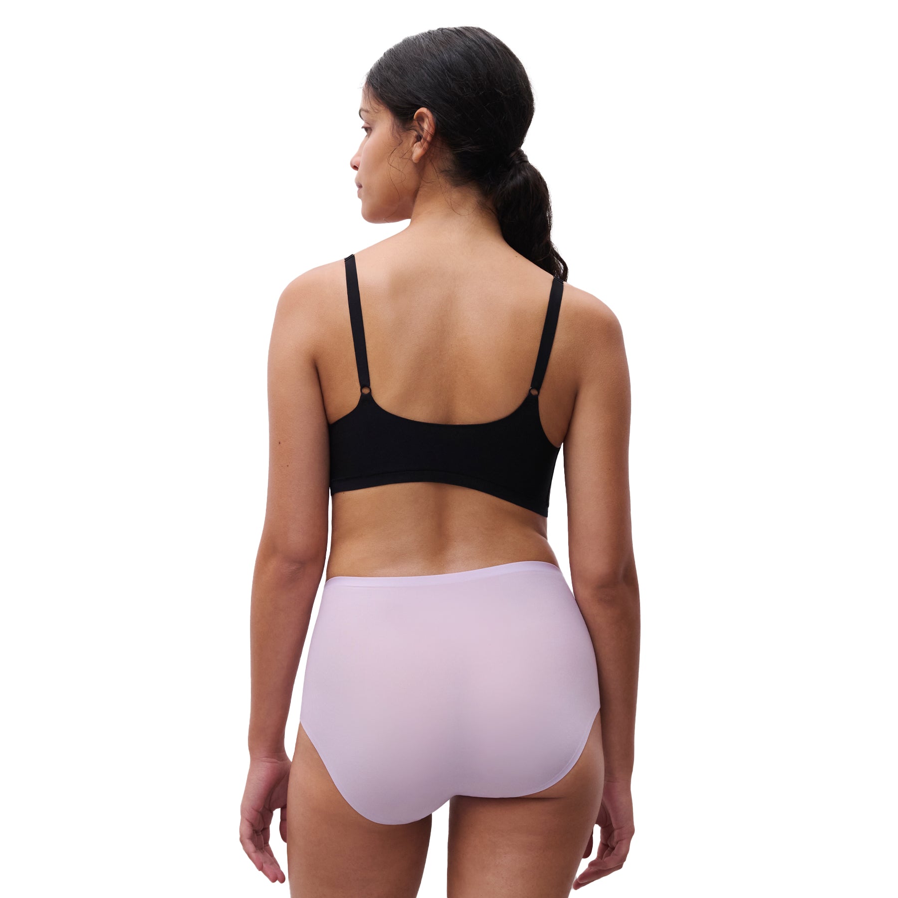 A model wearing a lavender chantelle full brief on the white background, back view.