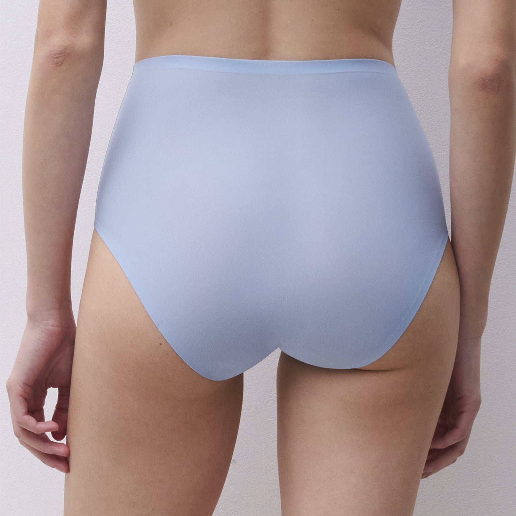Back view of icy powder blue seamless high-waist briefs with smooth laser-cut edges and invisible finish
