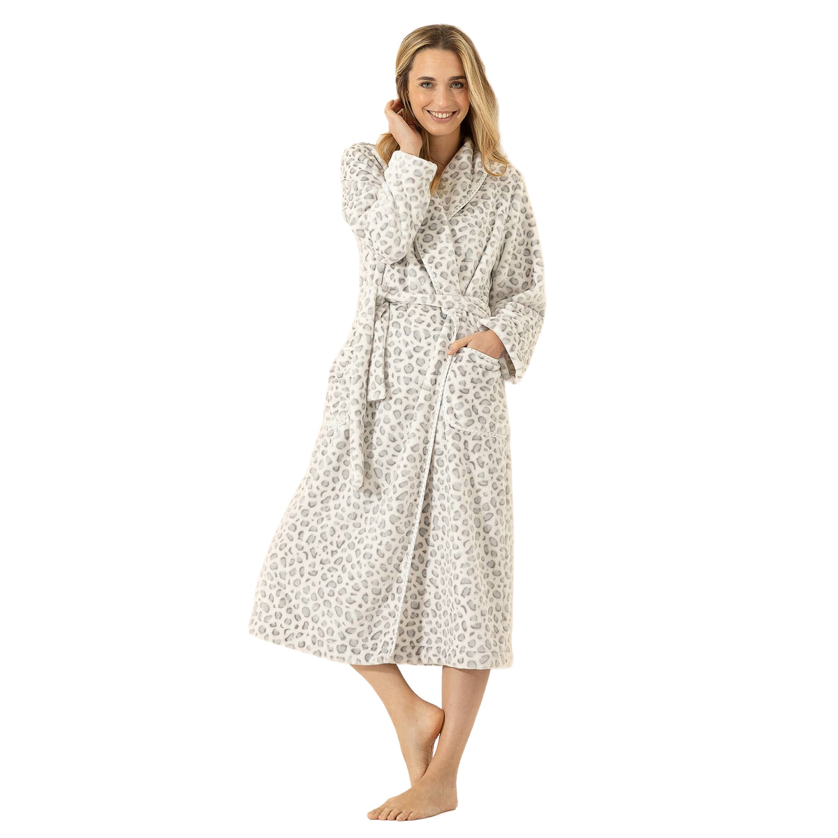 Model wearing a Le Chat long leopard print fleece robe with a matching waist belt, shawl collar, and spacious front pockets.