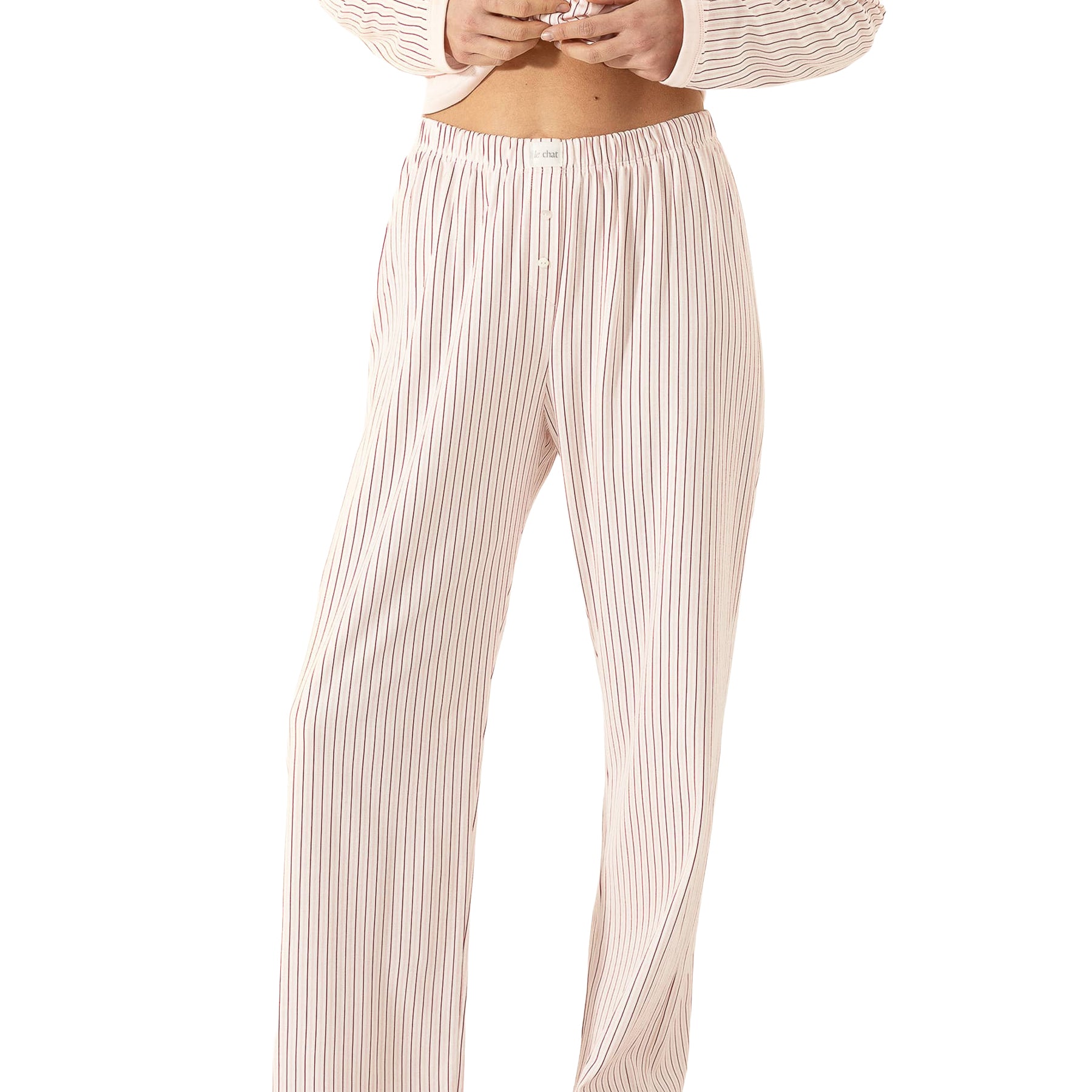 Blush pink striped pajama pants with a comfortable elastic waistband and decorative button details.