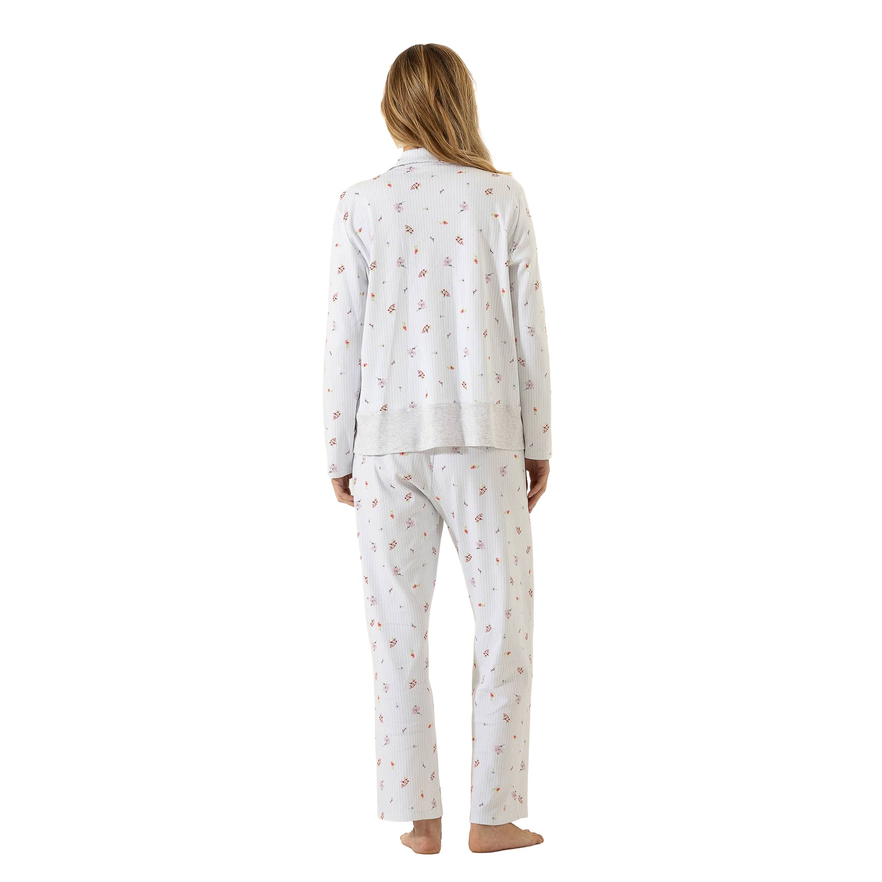 Back view of a white long-sleeve floral pajama set with a relaxed silhouette, contrast top hem, and straight-leg pants.