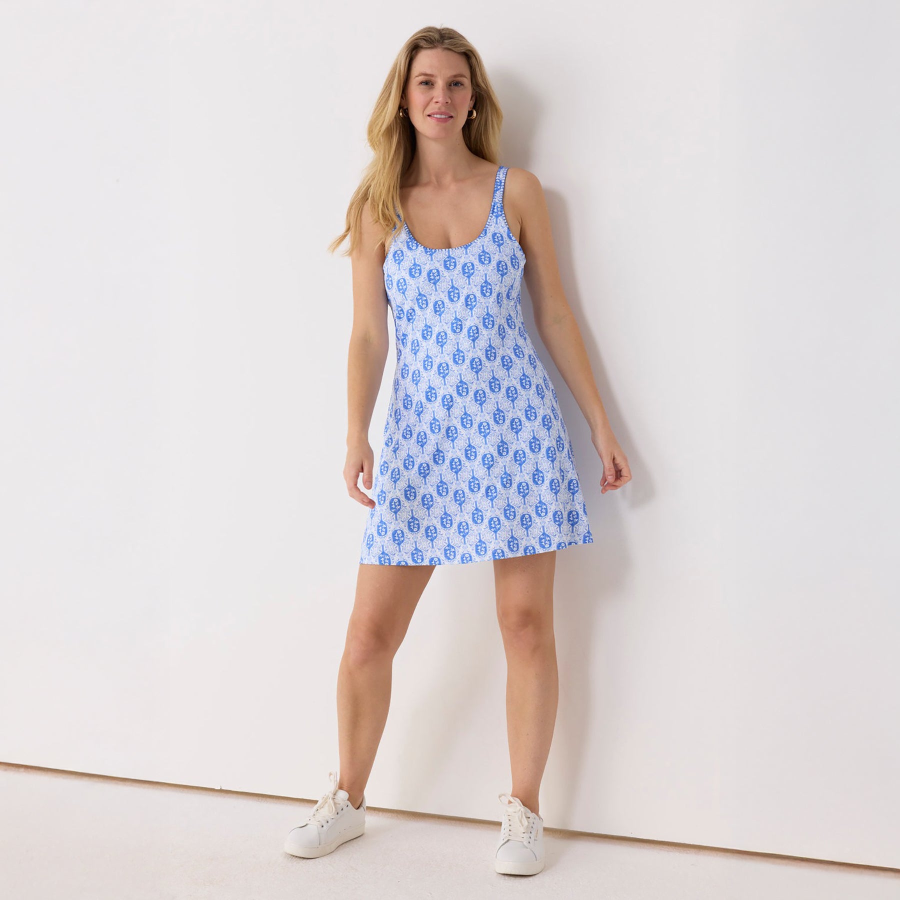 Full-length view of Cabana Life pickleball blue tank dress with built-in shorts, athletic casual style with floral-inspired print