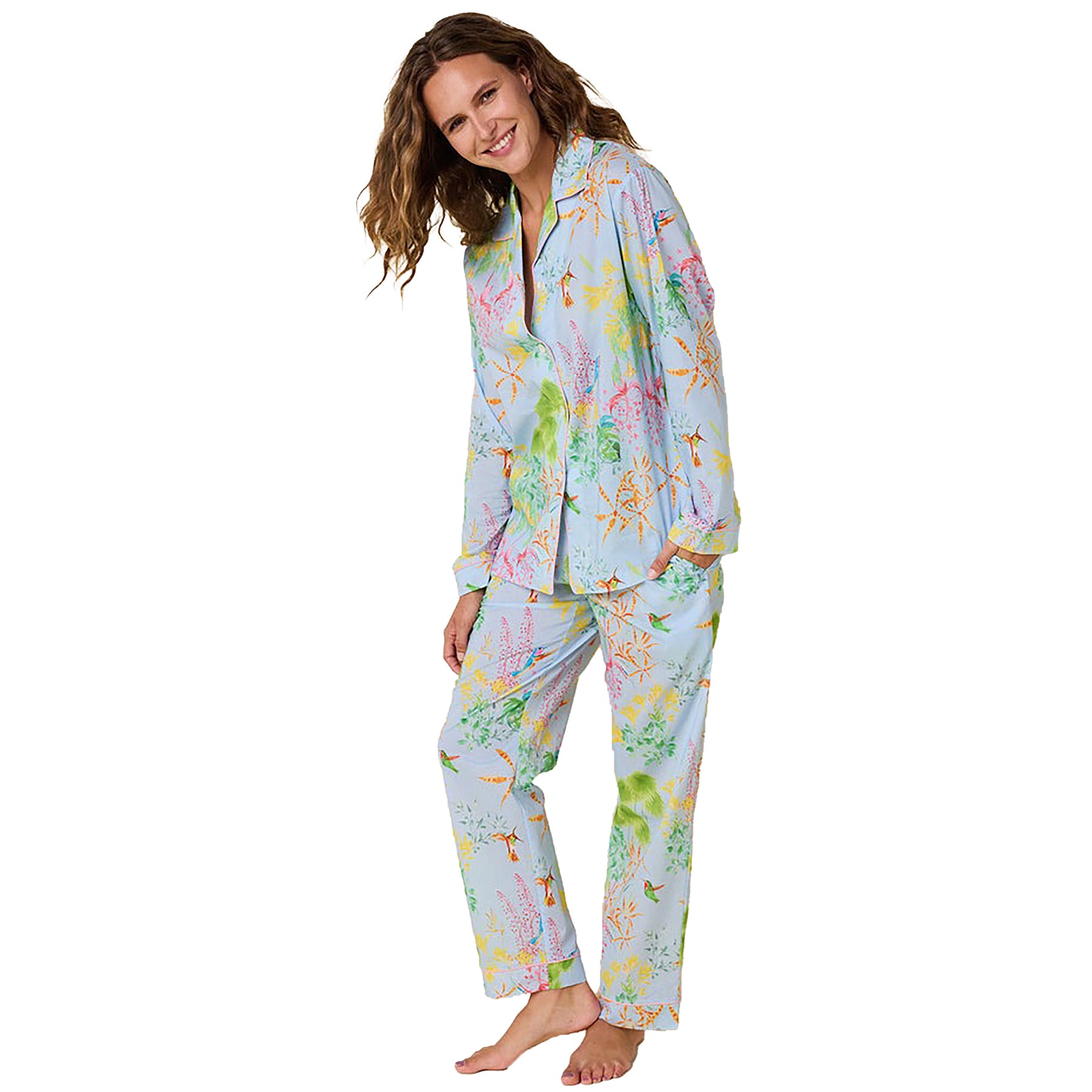 long sleeve button up pajamas with matching long pants in a multicolour hummingbird print on a blue background. Front view on model.