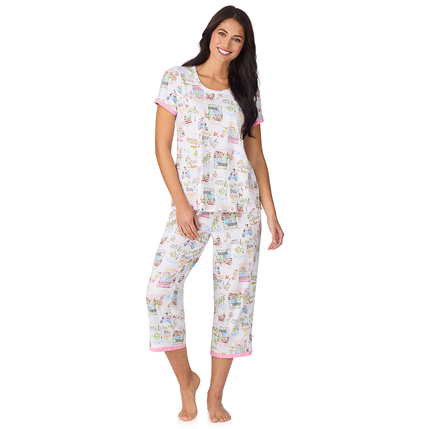 Front view of women’s white short sleeve pyjama set with cropped pants and playful cityscape print