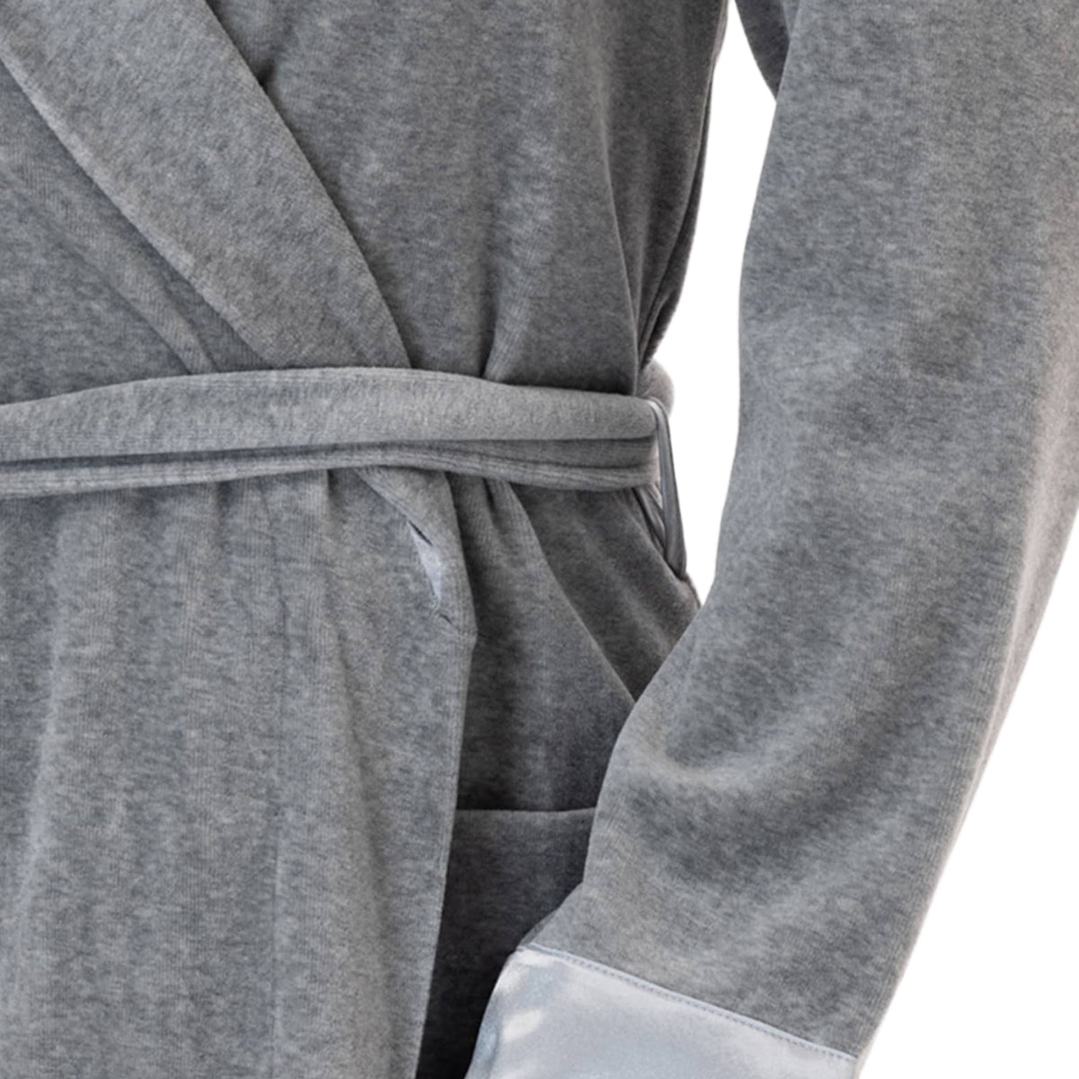Close-up detail of a grey velour robe showing the plush fabric, matching waist belt, and contrasting satin cuff.