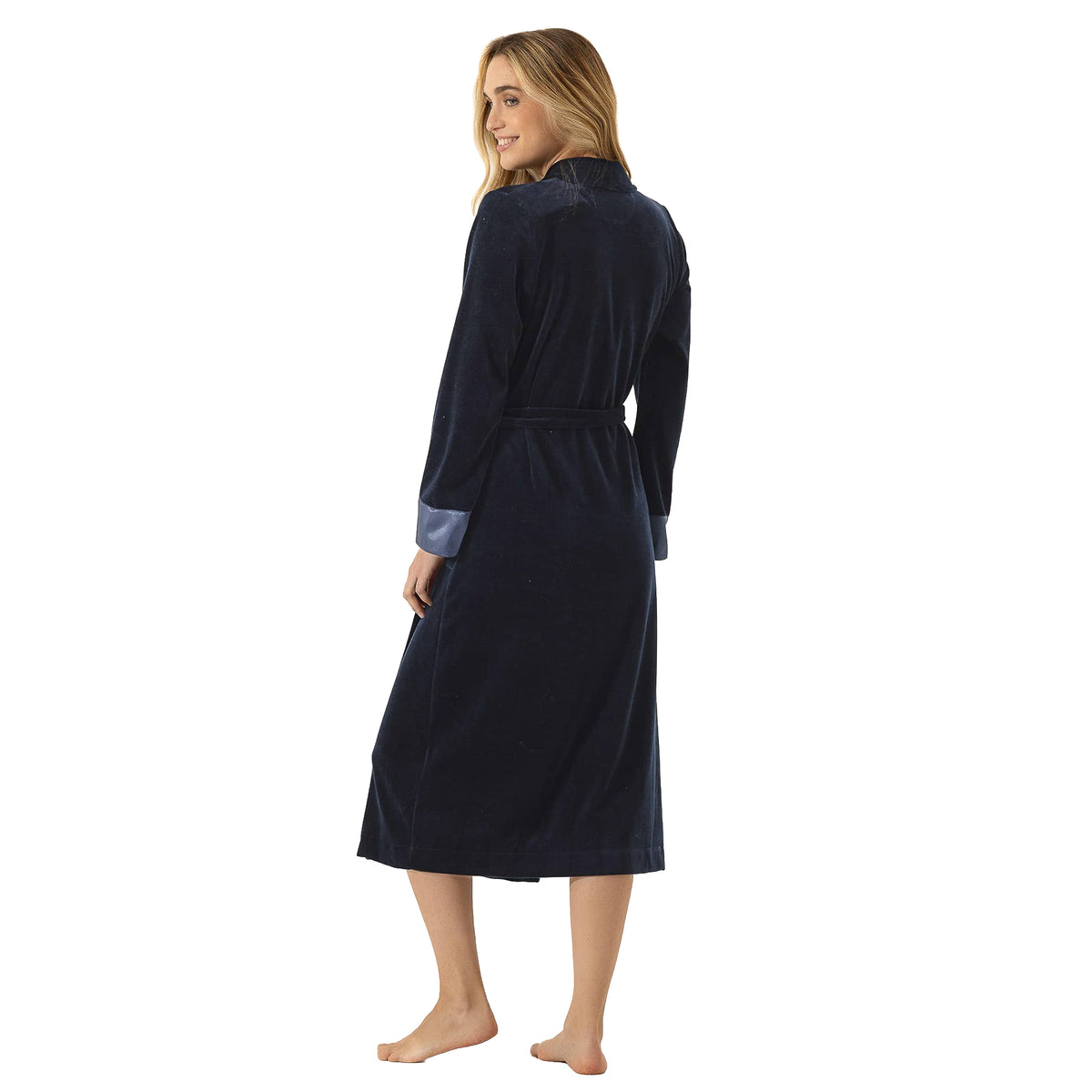 Back view of a long navy velour wrap robe with a matching waist belt, long sleeves, blue satin cuffs, and mid-calf length.