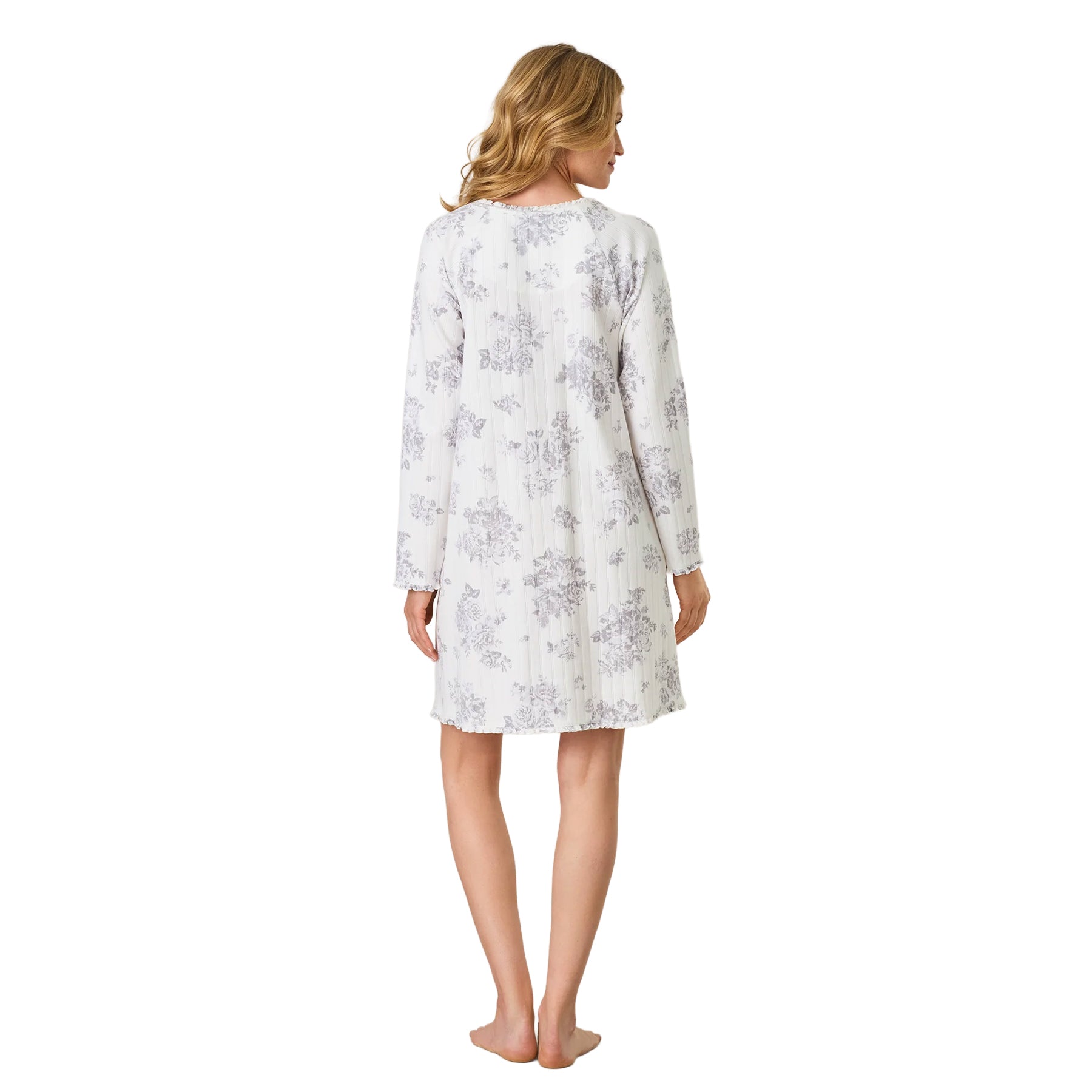 Back view of the women’s white floral nightgown featuring an all-over grey botanical print, long sleeves and relaxed knee-length fit.