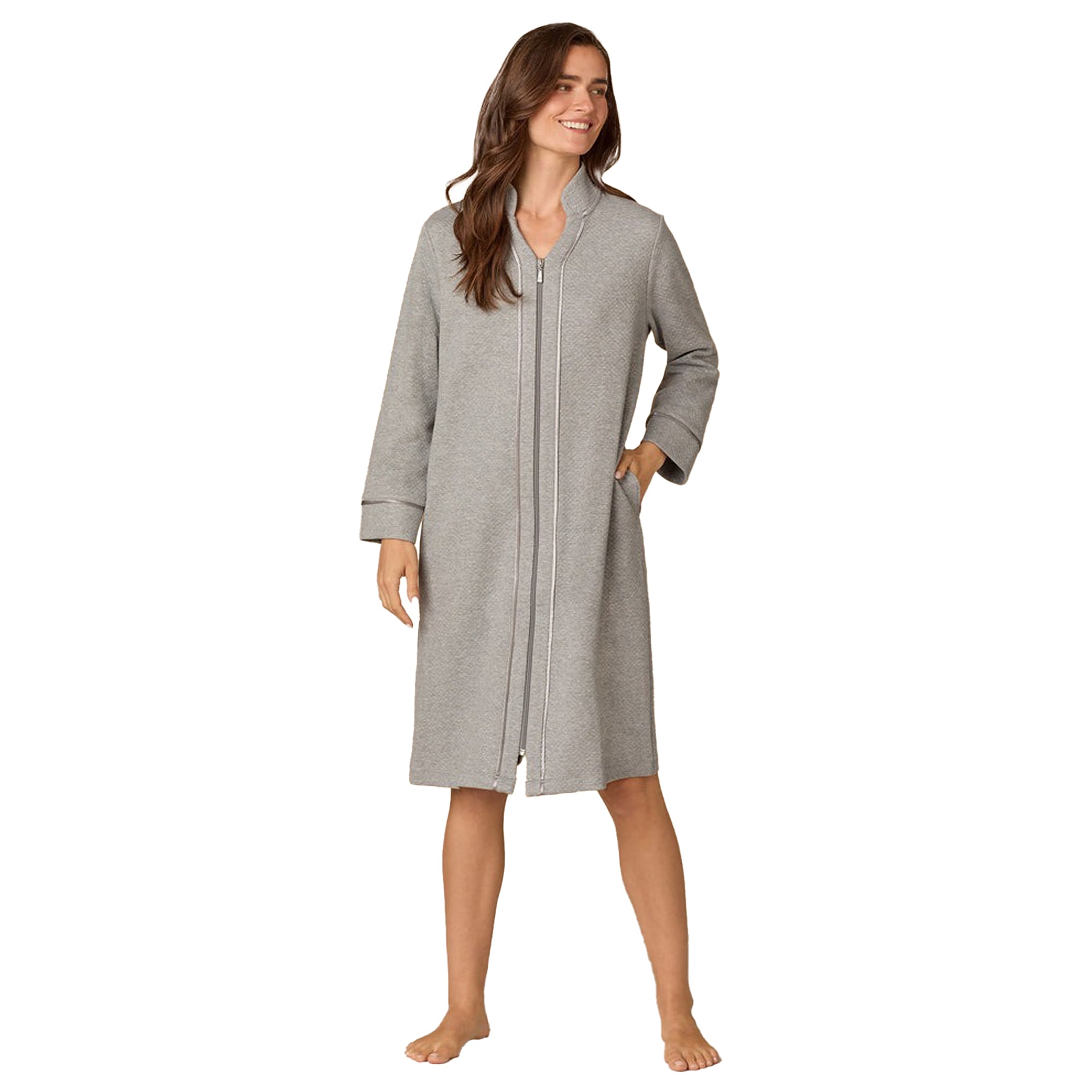 Woman wearing a gray robe on a white background