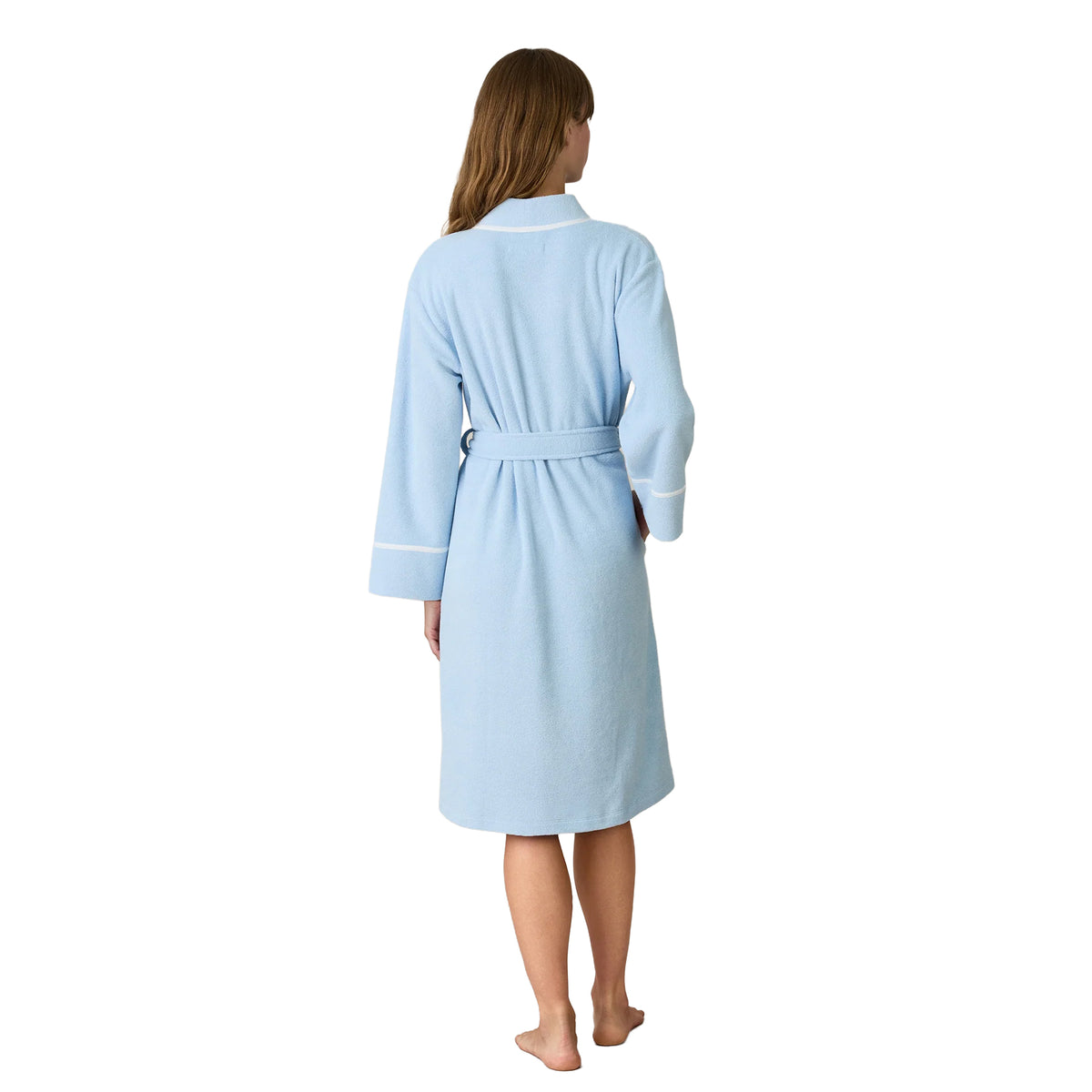 Back view of Carole Hochman light blue knee-length fleece robe featuring long sleeves with white contrast piping, a shawl collar and matching belt tied at the waist.