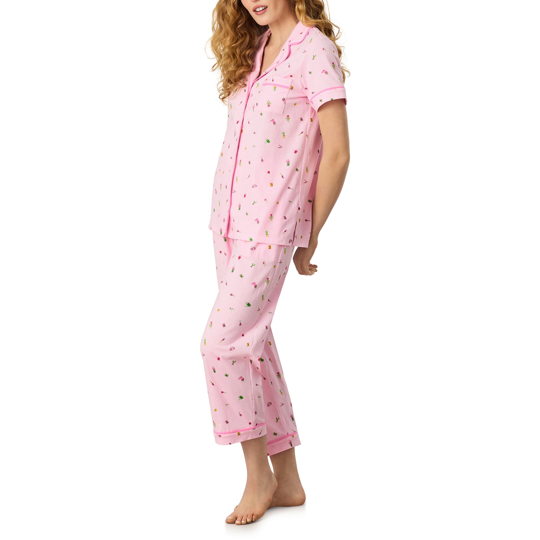 Carole Hochman light pink gardening print sleepwear set, short sleeve top with piping and relaxed fit capri pants, side angle