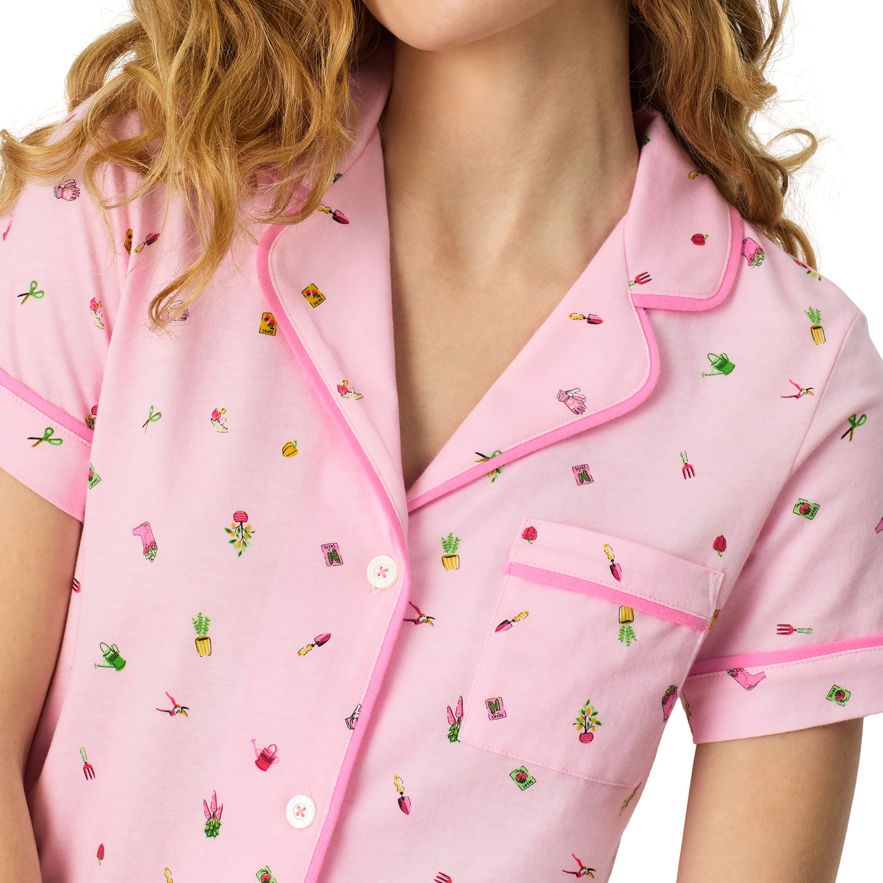 Close-up of Carole Hochman pink pyjama top with delicate gardening motif print and contrast piping detail