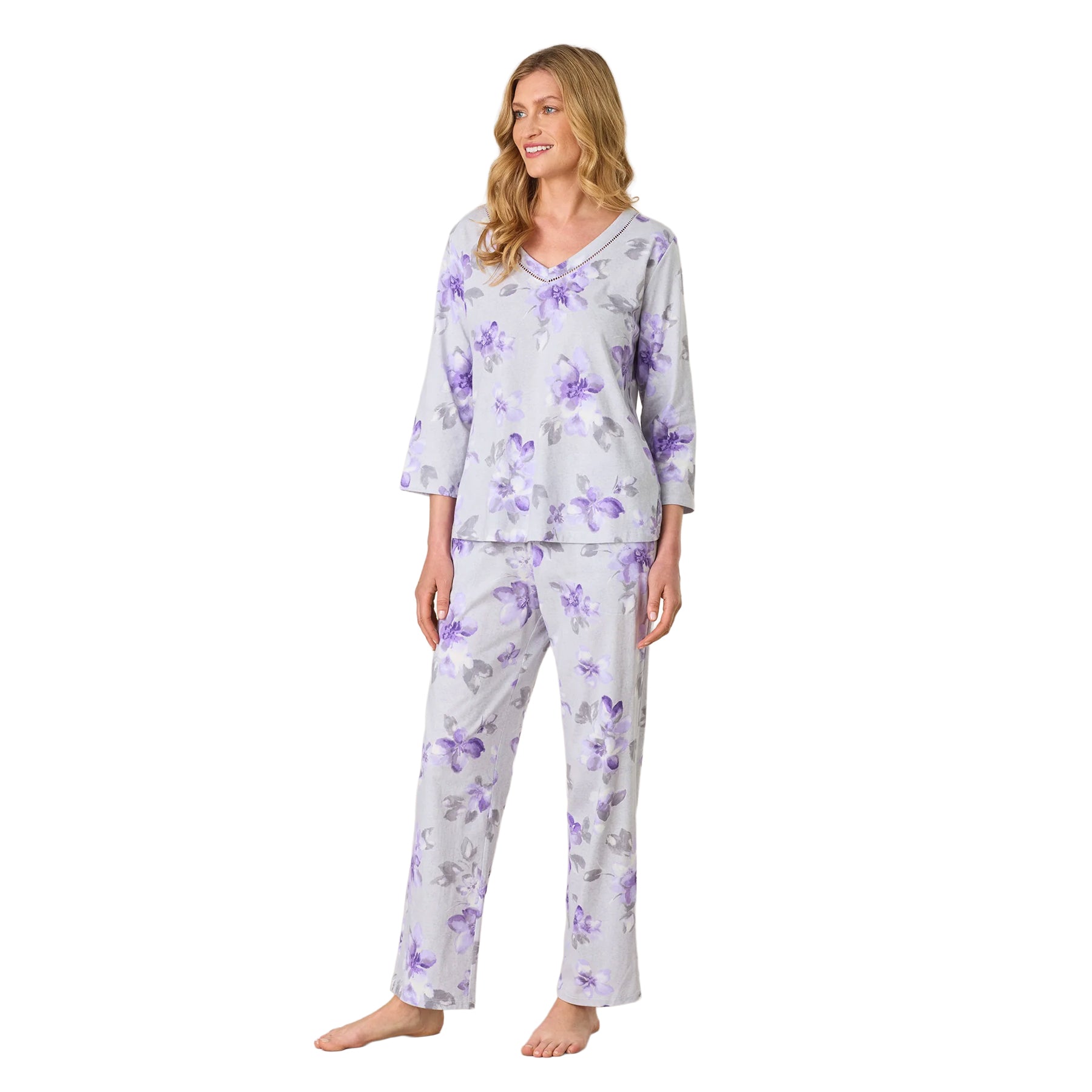 Grey and purple floral women’s pajama set shown from the front, featuring a relaxed-fit V-neck top and coordinating pants.