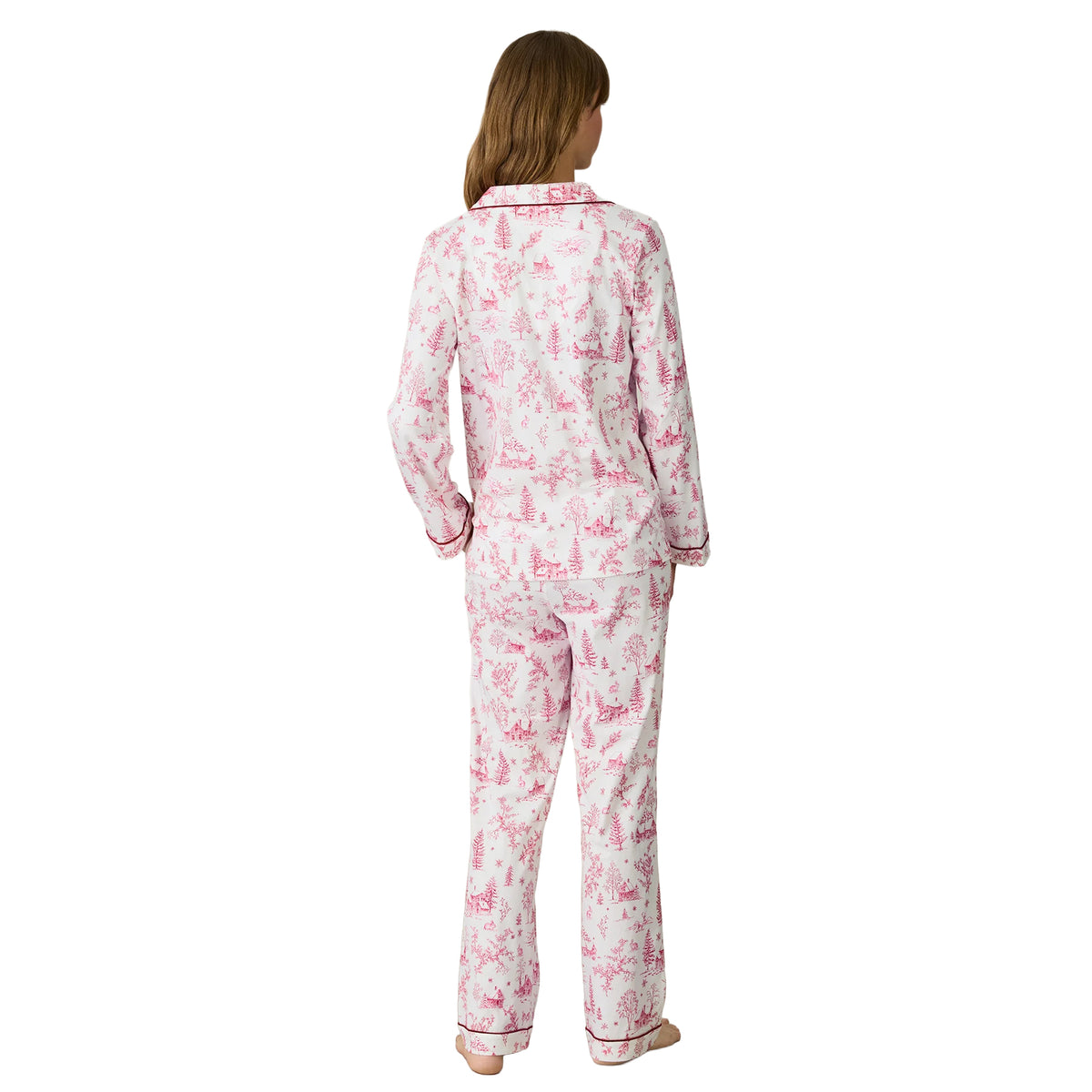 Back view of Carole Hochman white and pink winter print pajama set featuring a long-sleeve collared top and matching full-length pants with an all-over snowy cottage and woodland toile pattern.