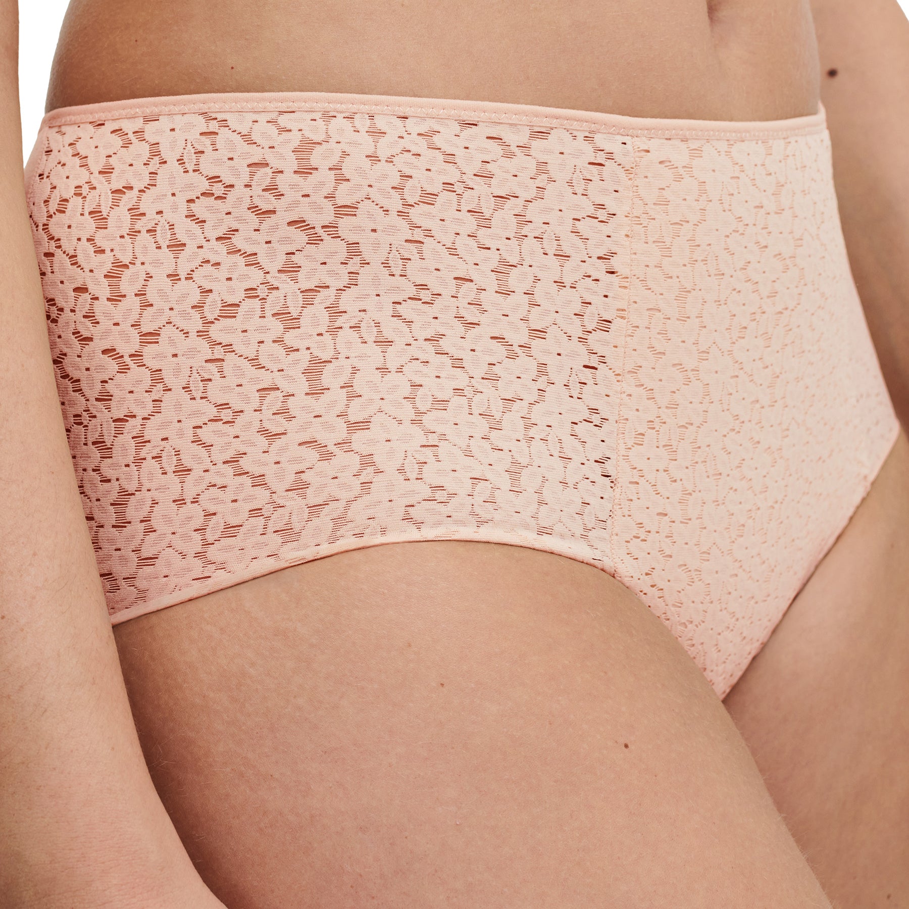 Chantelle light control Norah full brief with floral lace in nude golden beige. Side view close up on model.