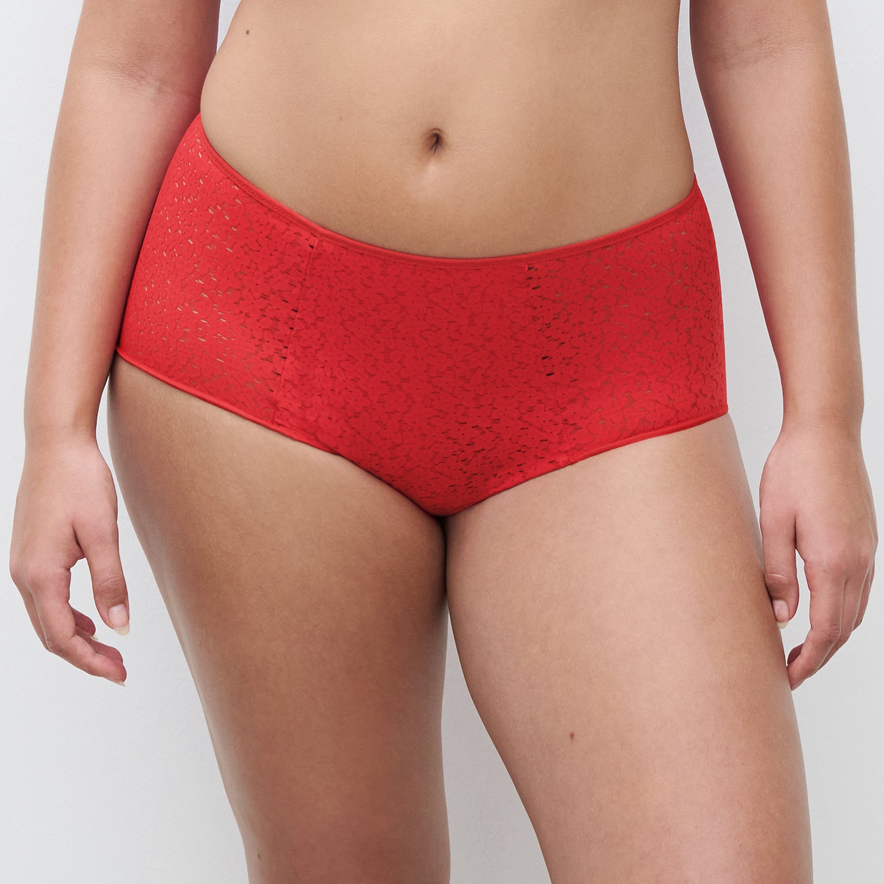 Chantelle light control Norah full brief C13F3 with floral lace in poppy red 0YU. Front view on model.