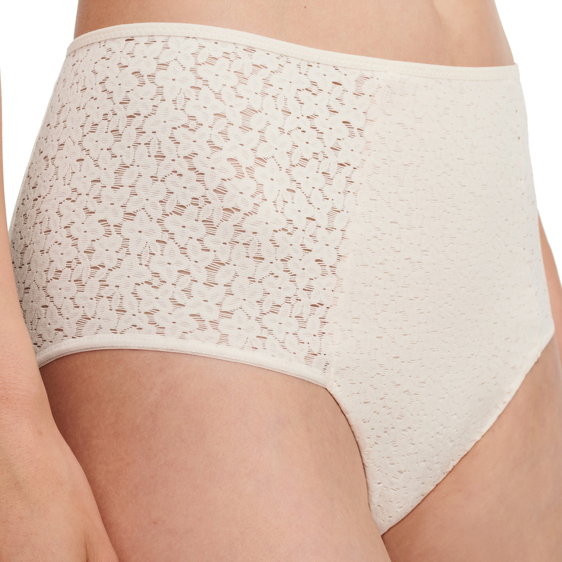 Chantelle light control Norah full brief with floral lace in ivory talc 0NL. Front view close up on model.