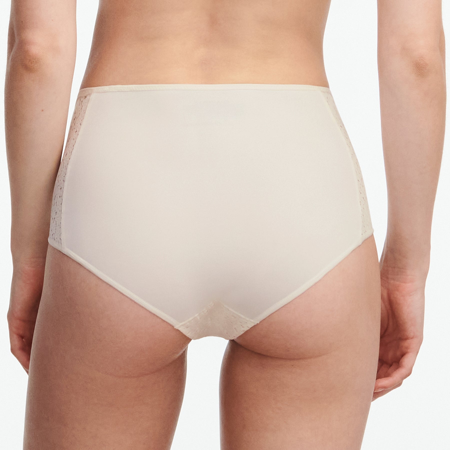 Chantelle light control Norah full brief with floral lace in ivory talc 0NL. Rear view on model.