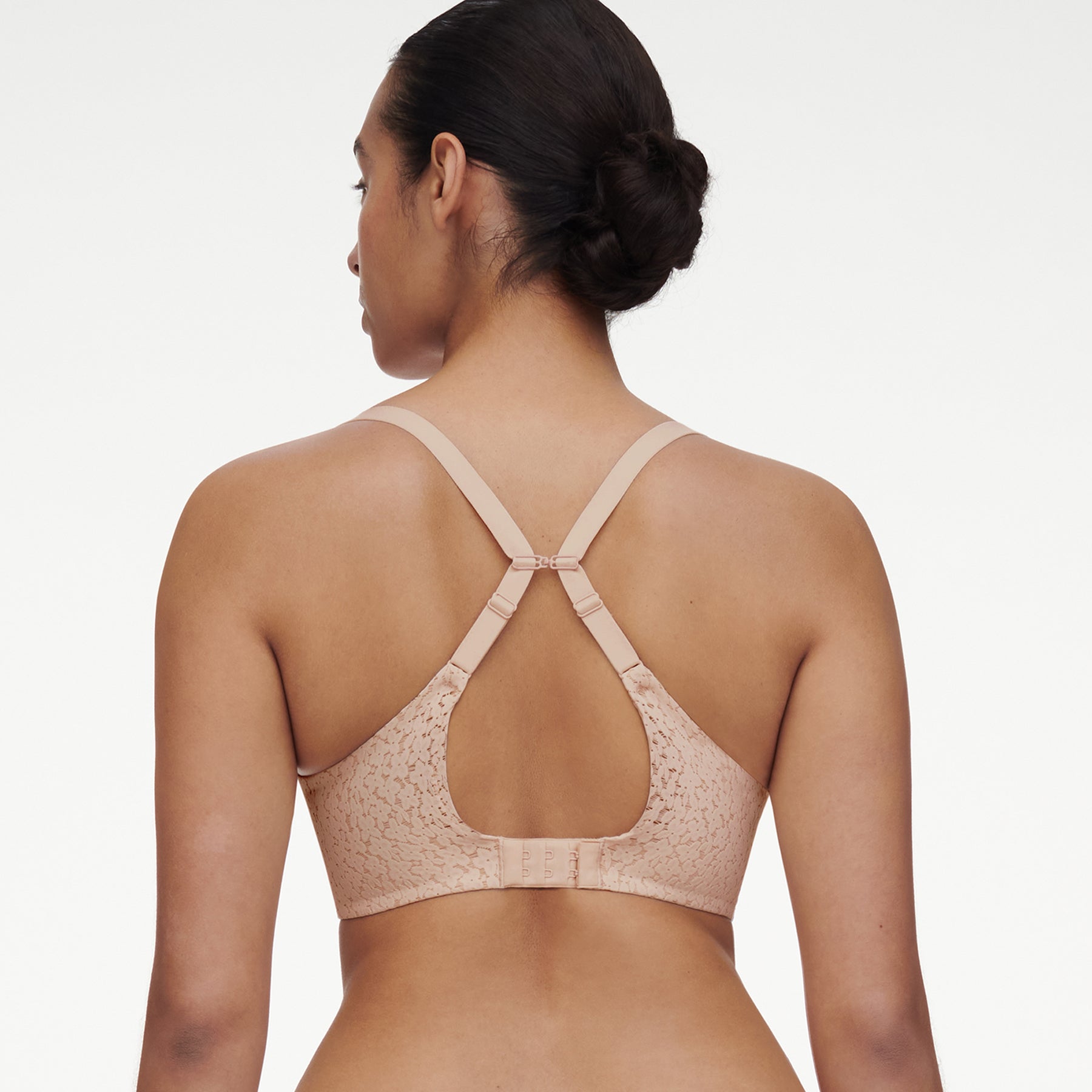 Chantelle molded full cup underwired spacer bra in nude golden beige. Rear view on model showing J-hook.