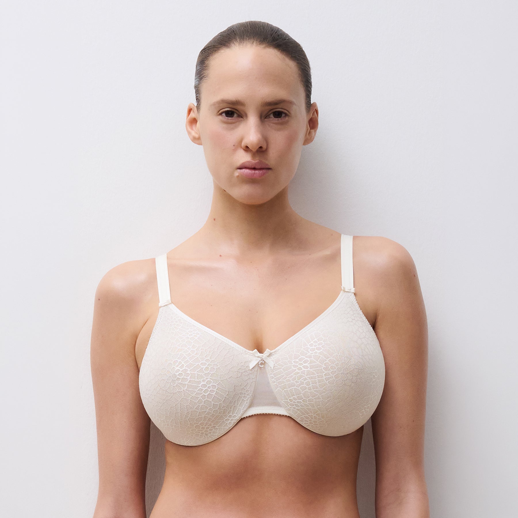 Chantelle C1891 C Magnifique seamless minimizing full cup bra in ivory 035. Front view on model.