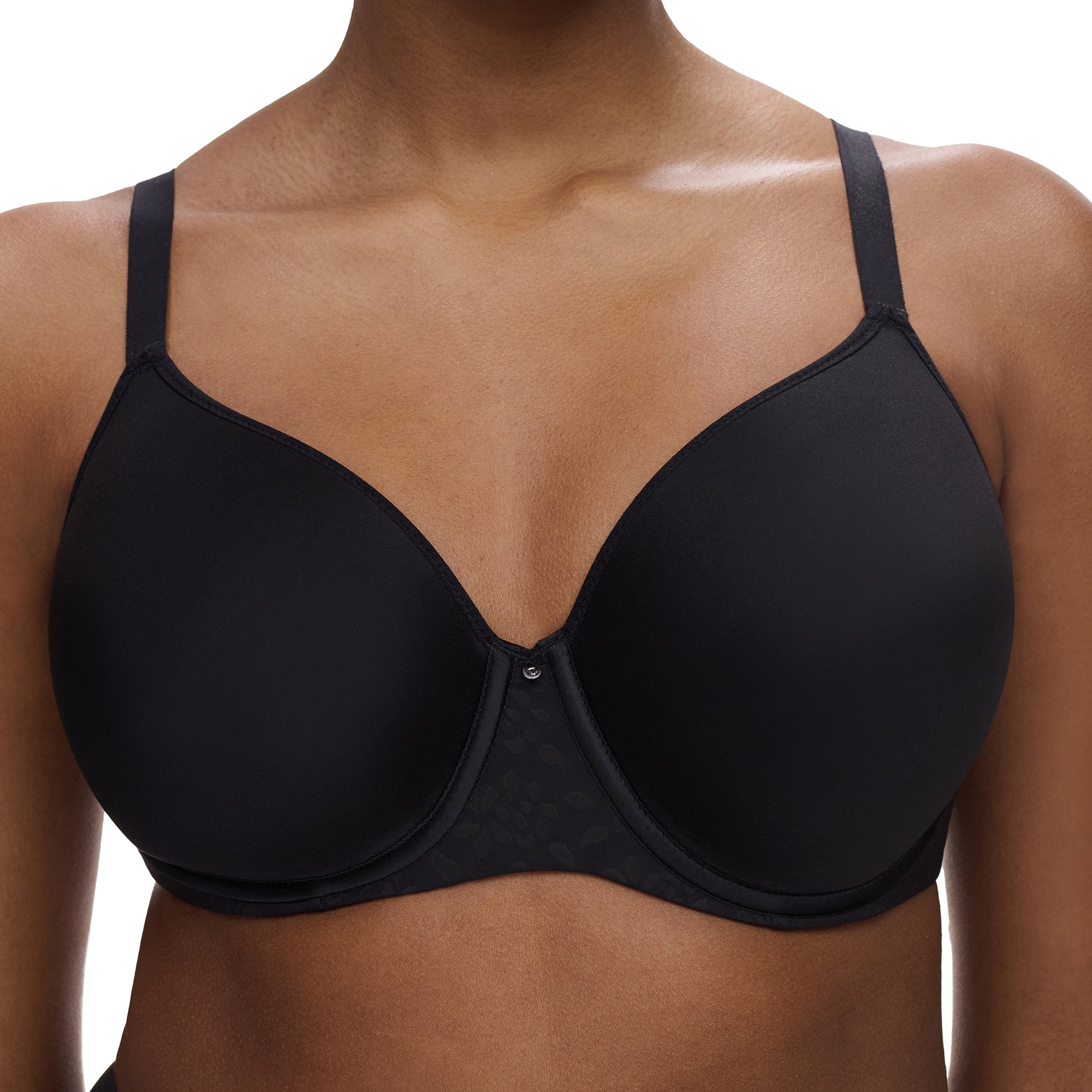 Close-up of Chantelle Comfort Chic black molded spacer bra showing smooth full cups, centre gore detail, and lightweight fabric