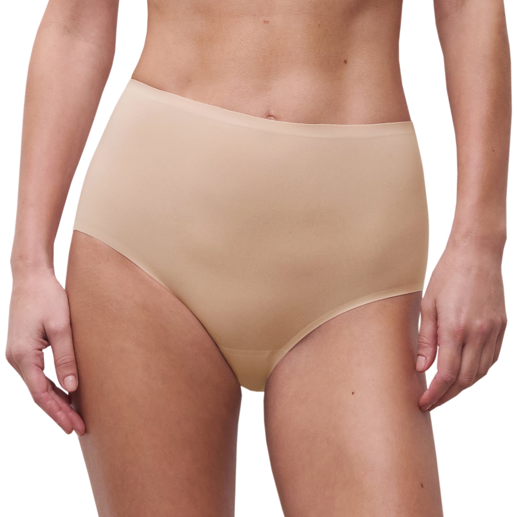 Model wearing Chantelle Soft Stretch full brief in Golden Beige, high-rise seamless underwear with second-skin fit and smooth finish.