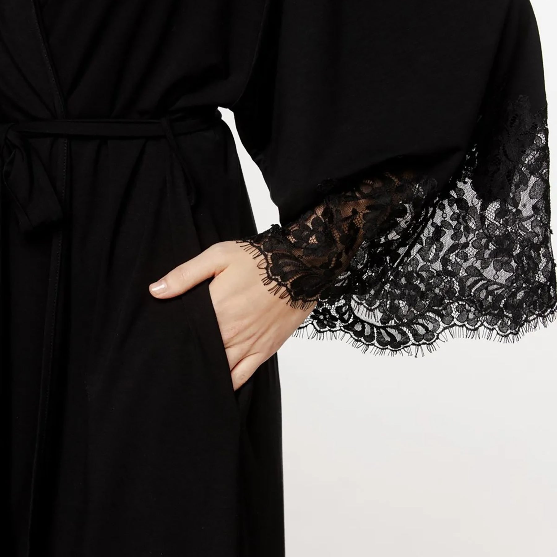close-up of coemi giulia black robe lace cuff detail on bell sleeves