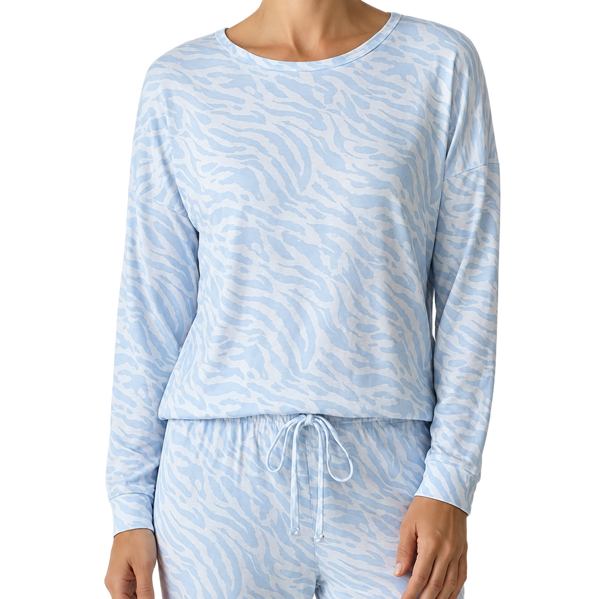 Close-up of a light blue and white zebra print pyjama set, featuring a round neckline, relaxed long sleeves, and an adjustable drawstring waistband.