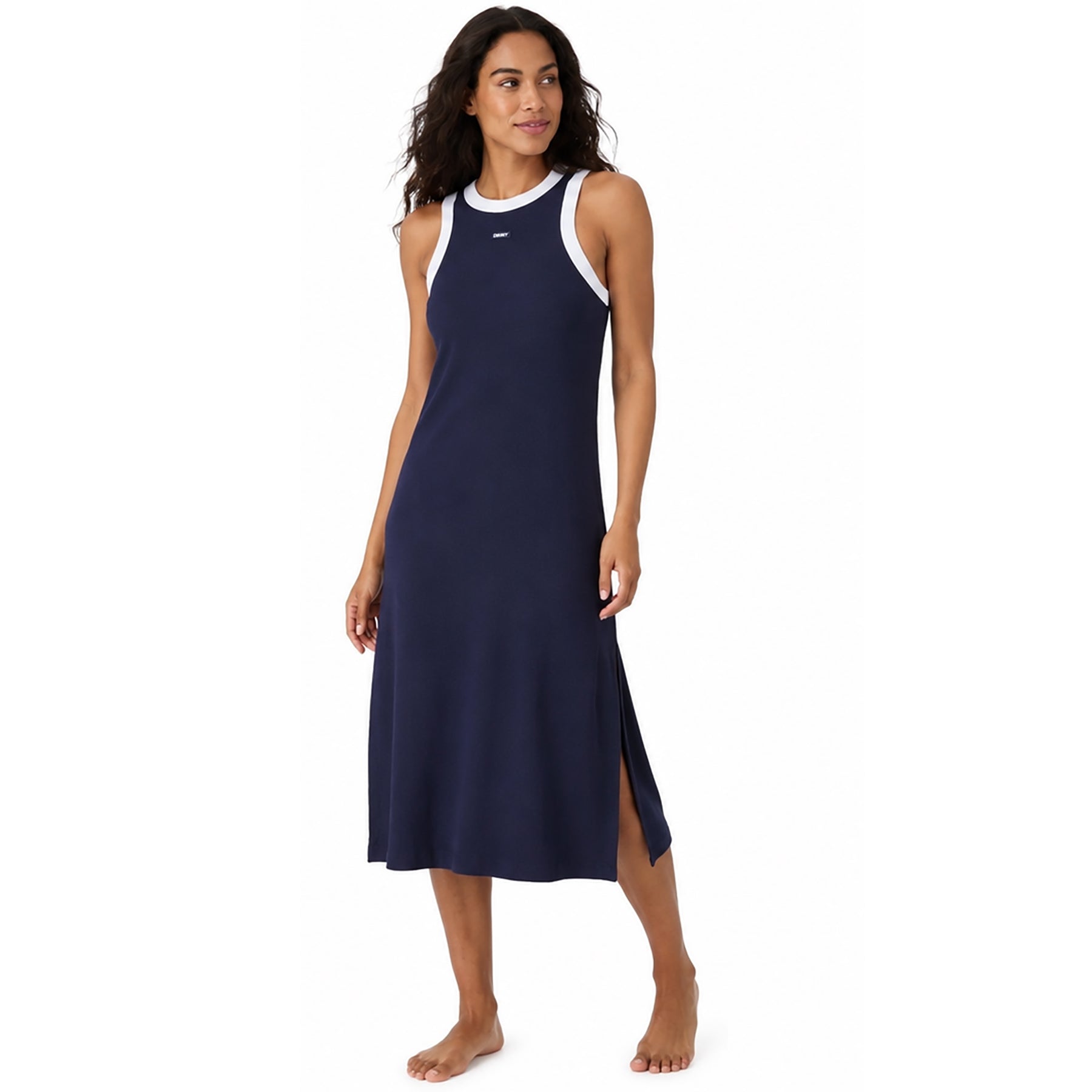 Woman wearing a DKNY Y00112 navy ribbed midi lounge dress with white contrast trim and side slit, full-length view highlighting the relaxed fit and casual sporty style.