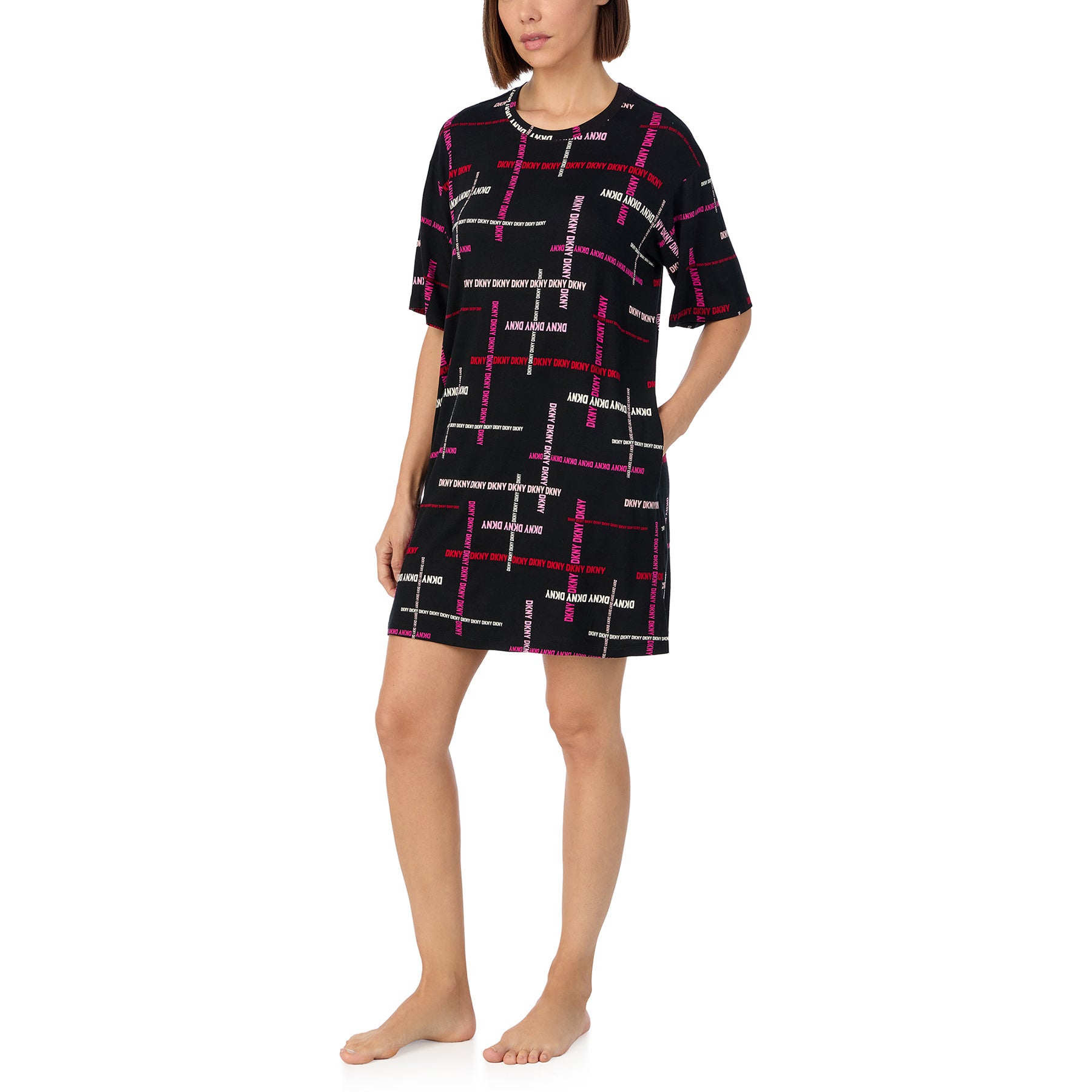 Short sleeve round neck sleepshirt in black with DKNY logo print in shades of pink. Front view 2 on model.