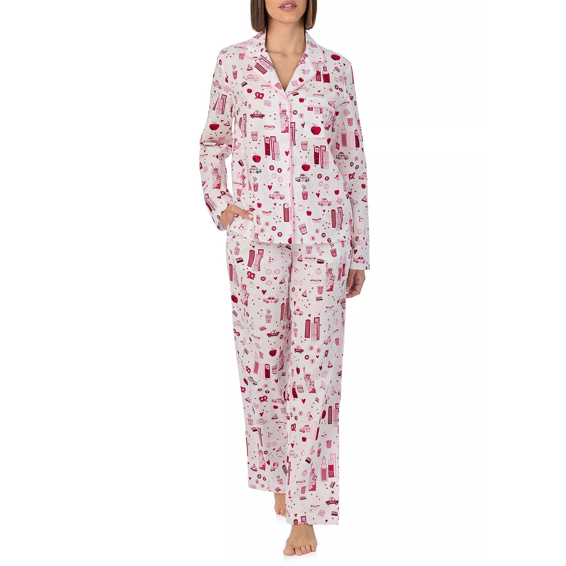 Classic 2-piece button up pyjama set printed with new york city items in red and pink on a white background. Front view 2 on model.