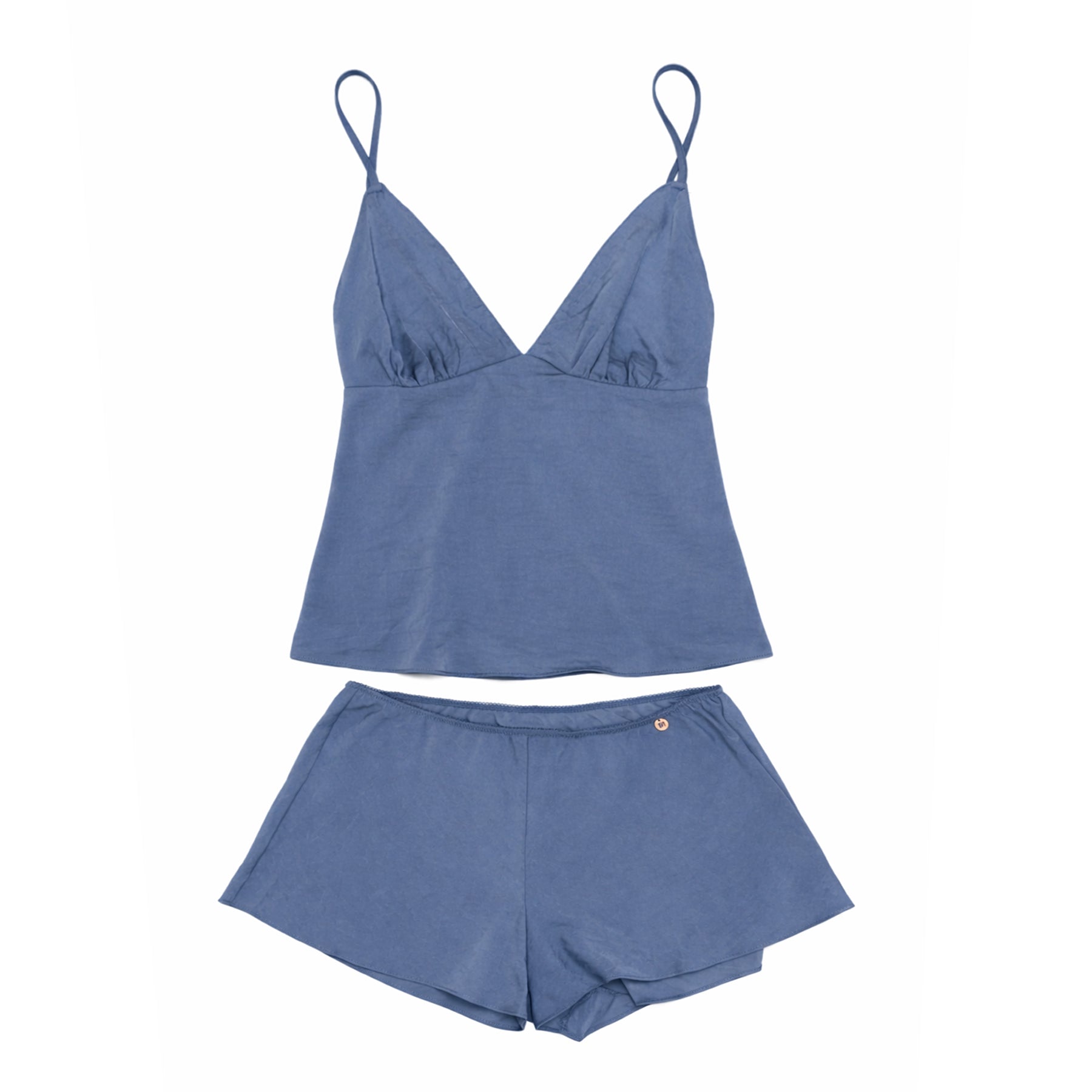 Blue satin camisole and matching lounge shorts set in flat lay on white background, featuring V-neck cami with thin straps and relaxed-fit shorts.