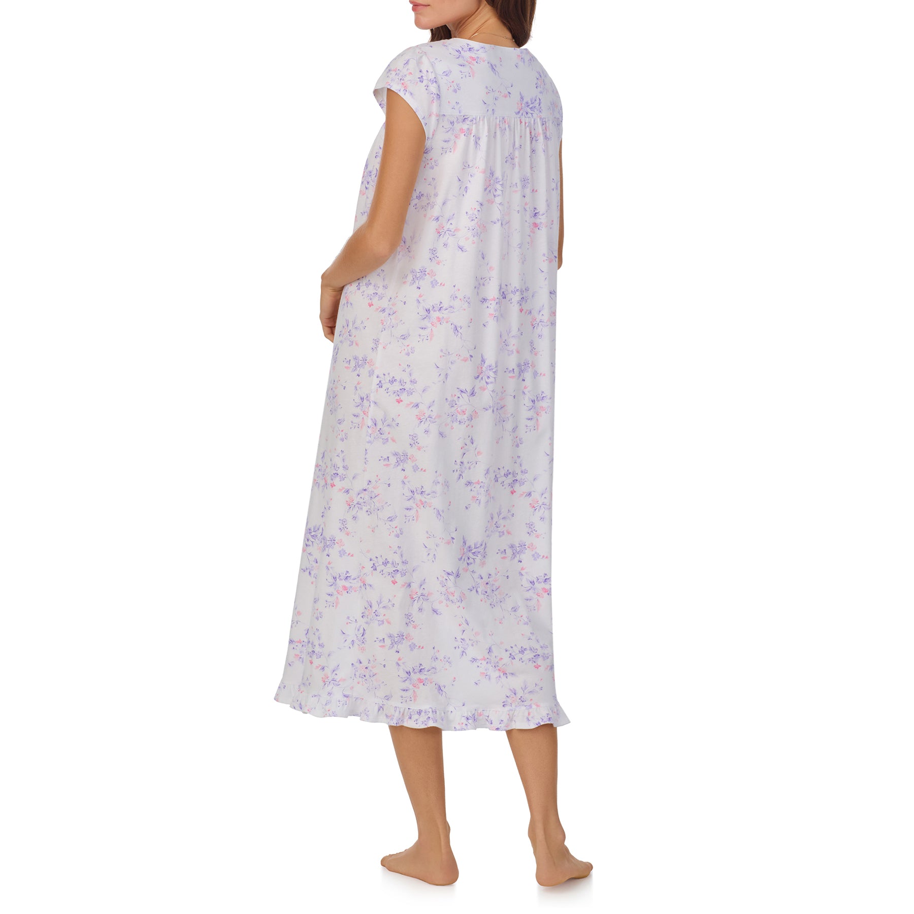 Side View of a women's floral nightgown in a white and lilac floral print, showcasing intricate lace trim, button detailing, and cap sleeves.