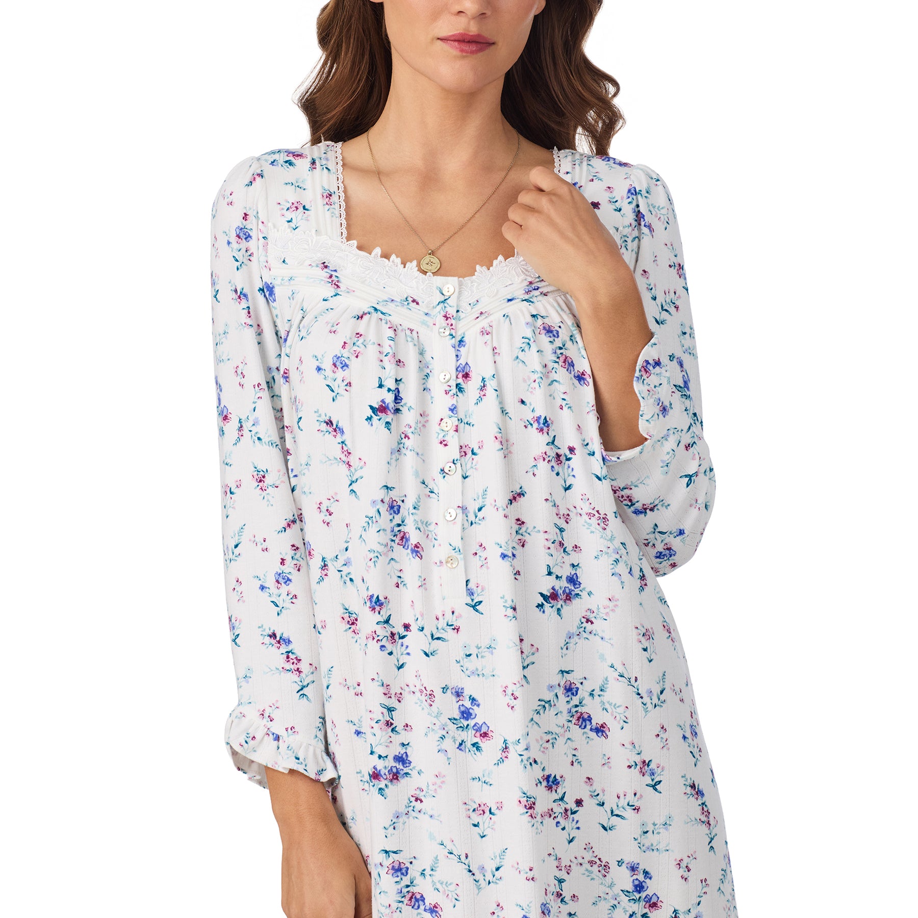 Woman wearing a floral long-sleeve top on a white background