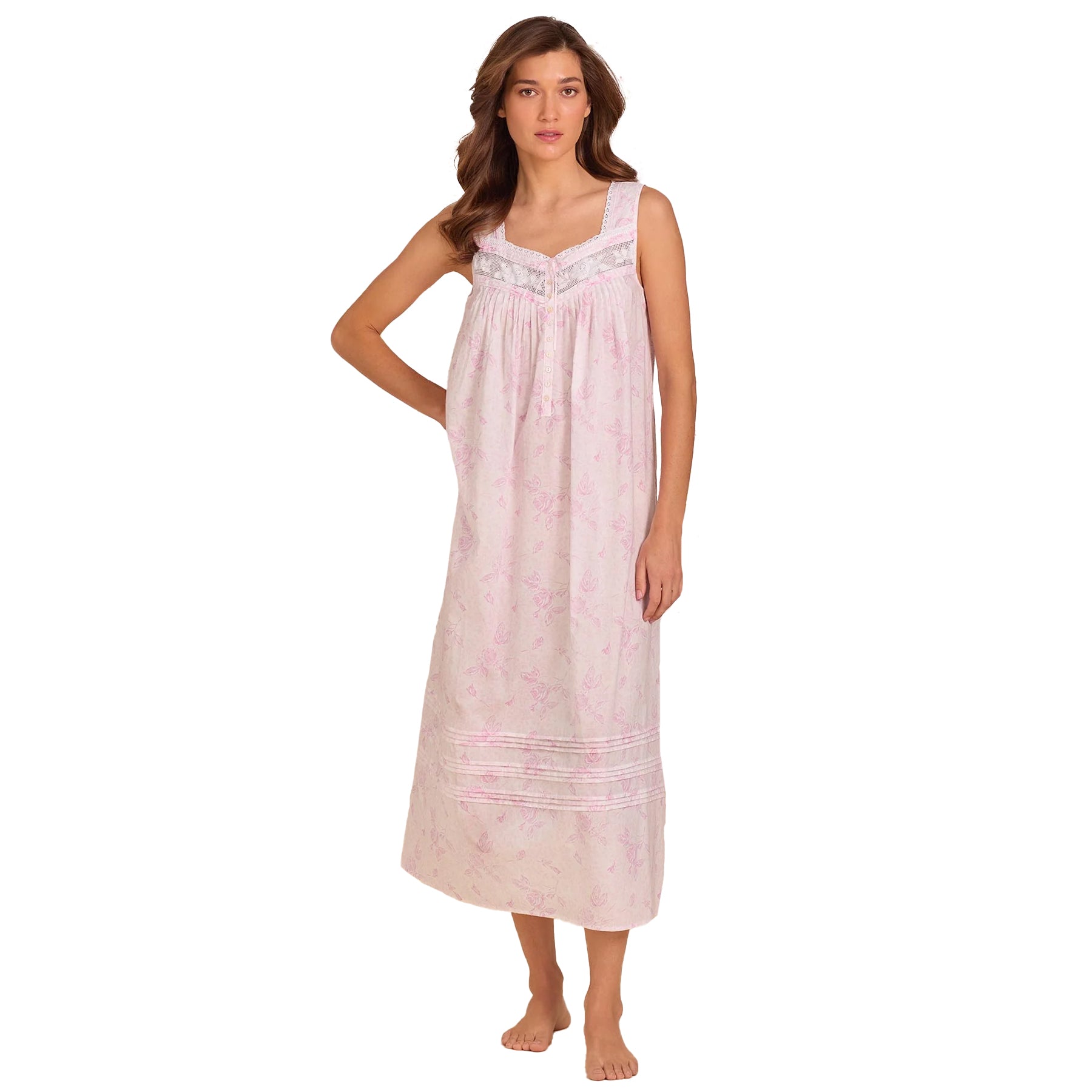 Woman wearing a sleeveless pink floral cotton nightgown with lace detailing and soft gathered bodice.
