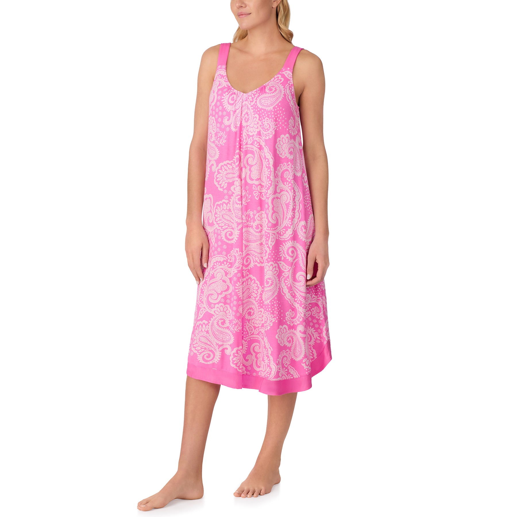 Full-length front view of a women wearing a pink paisley nightdress with a softly draped shape and elegant print.