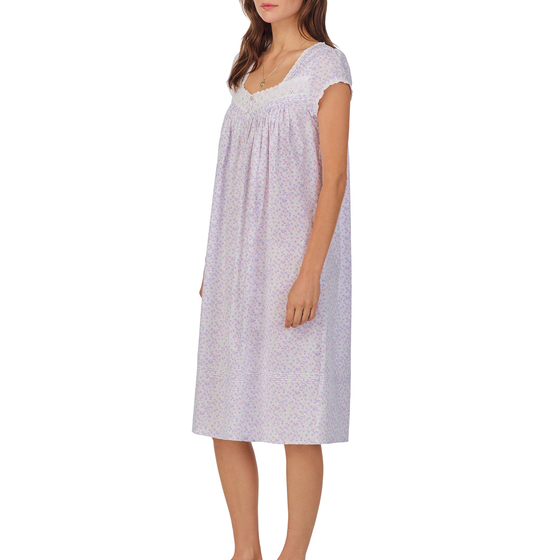 Front/Side view of a women's floral nightshirt in a white garden daisy print, showcasing intricate lace trim, button detailing, and cap sleeves.