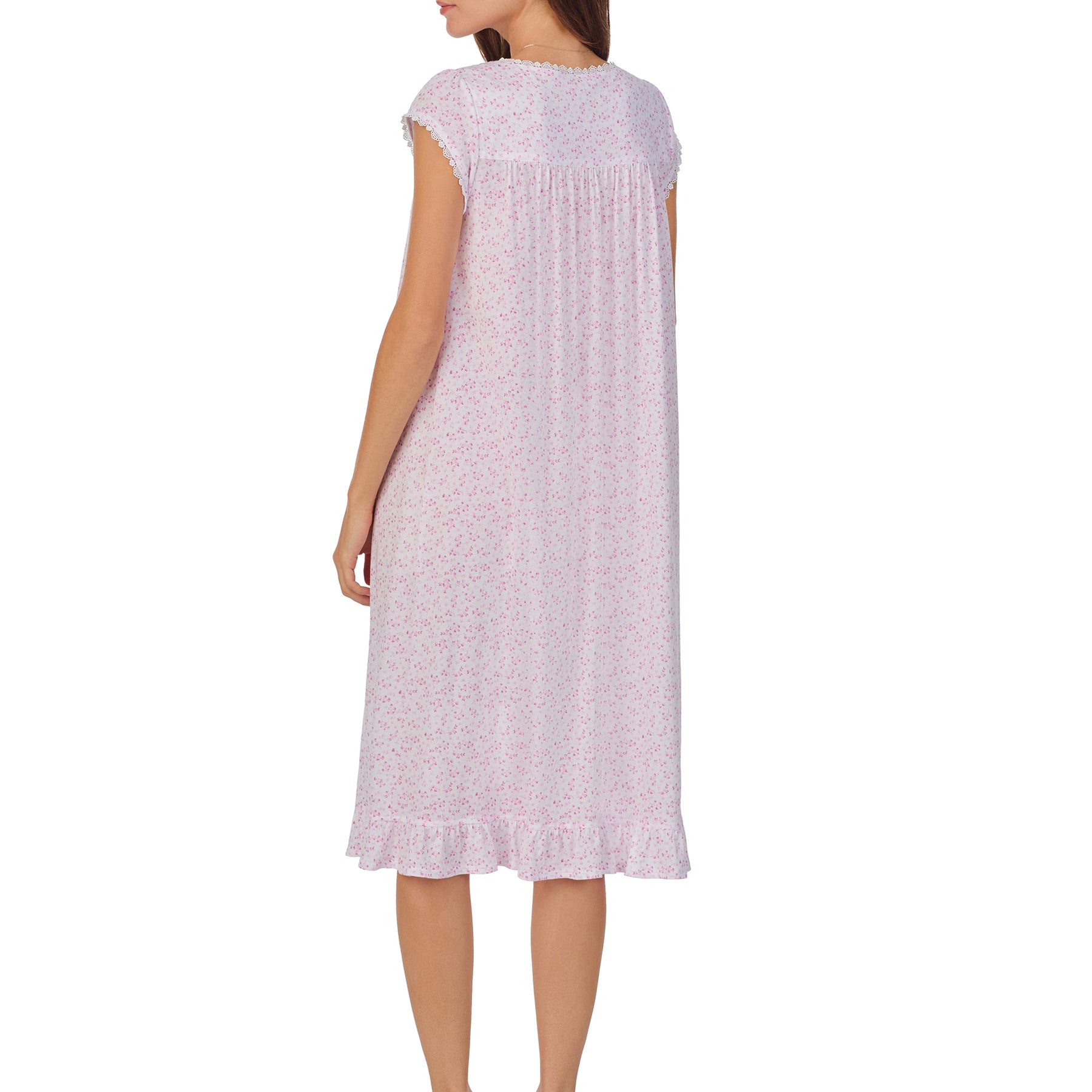 Back view of a women's floral nightshirt in a white pink ditsy print, showcasing intricate lace trim, button detailing, and cap sleeves.